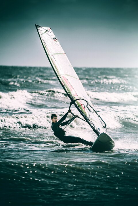 Windsurfer Carving Through Waves