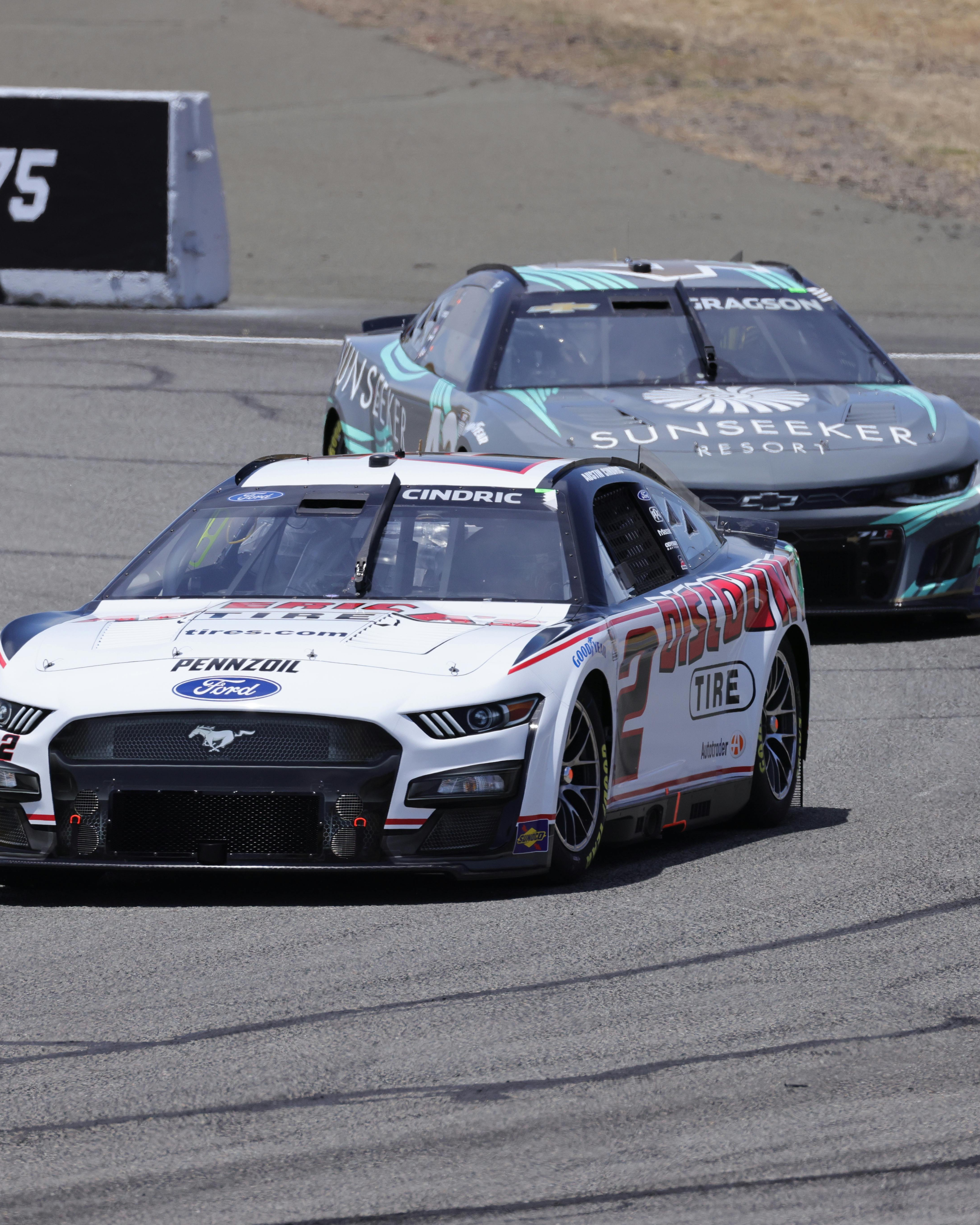 Two NASCAR Race Cars Competing on Track