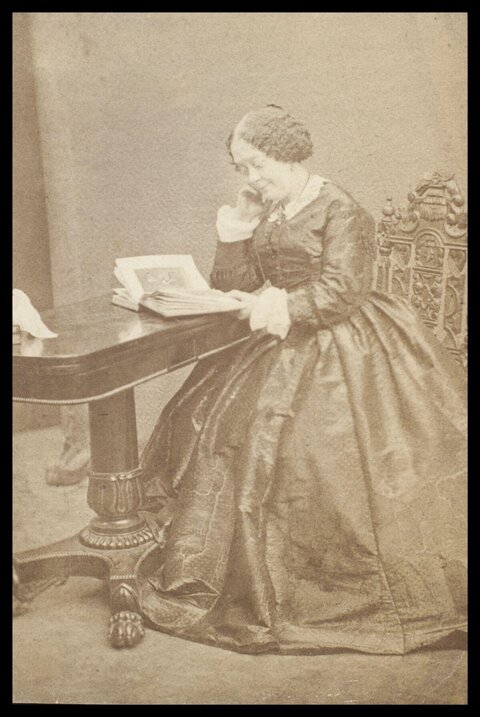 Victorian Woman Reading at Table