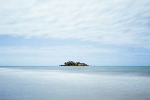Small Islet in Calm Sea