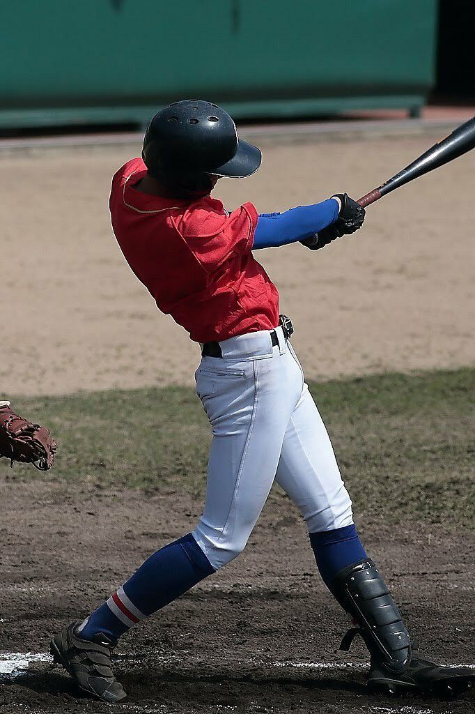 Youth Baseball Batter After Swing