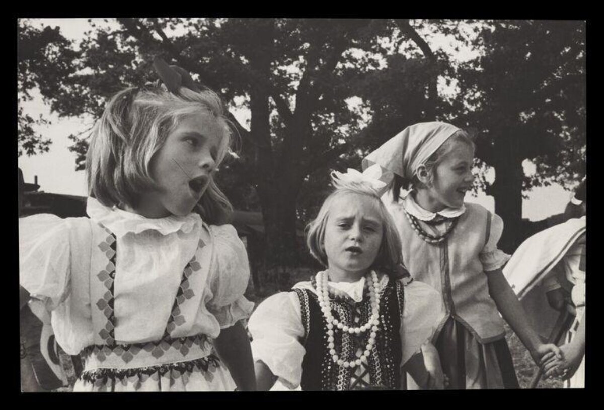Three Girls in Folk Costumes Outdoors