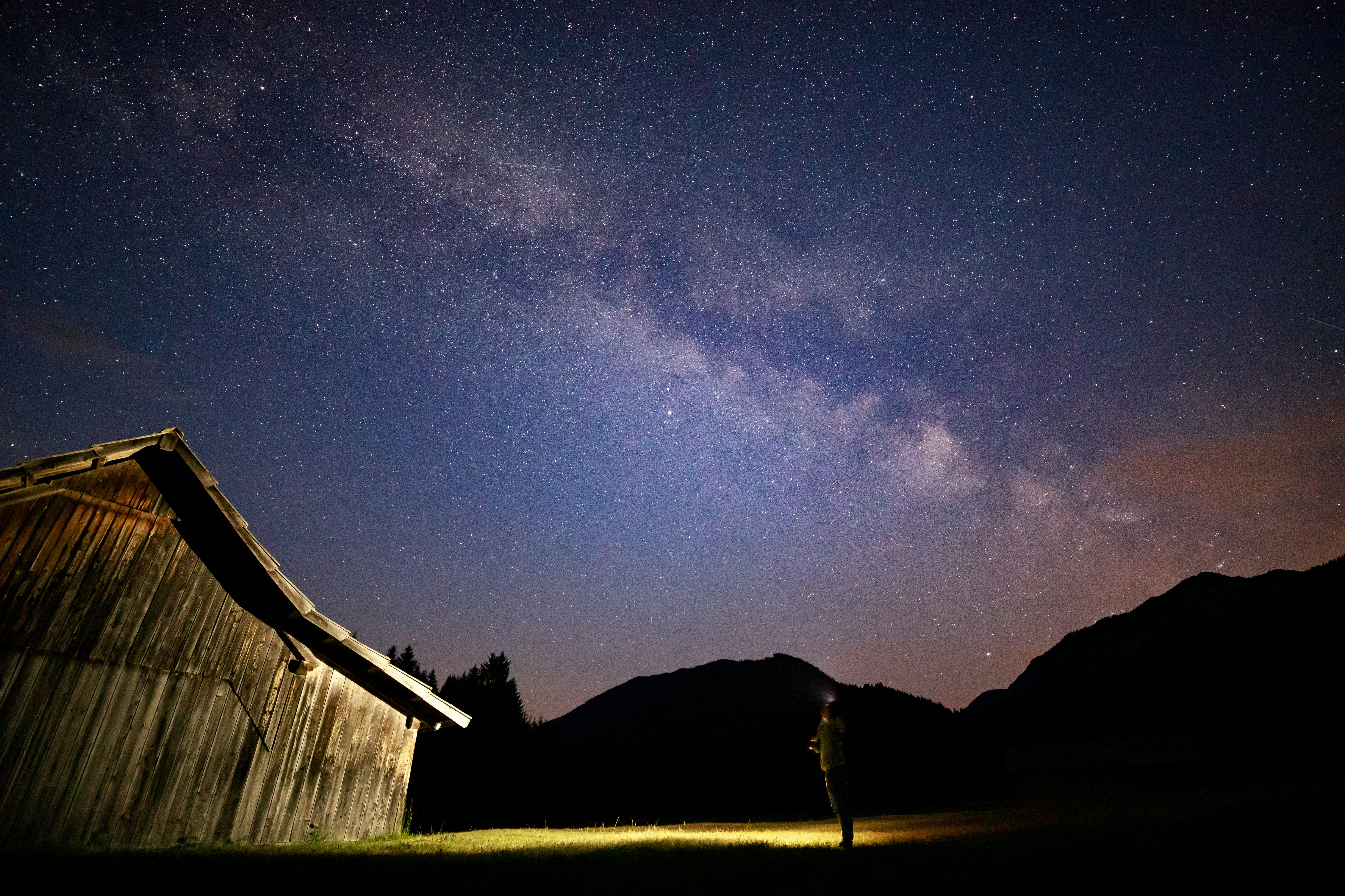 Starry Milky Way Over Mountain Cabin