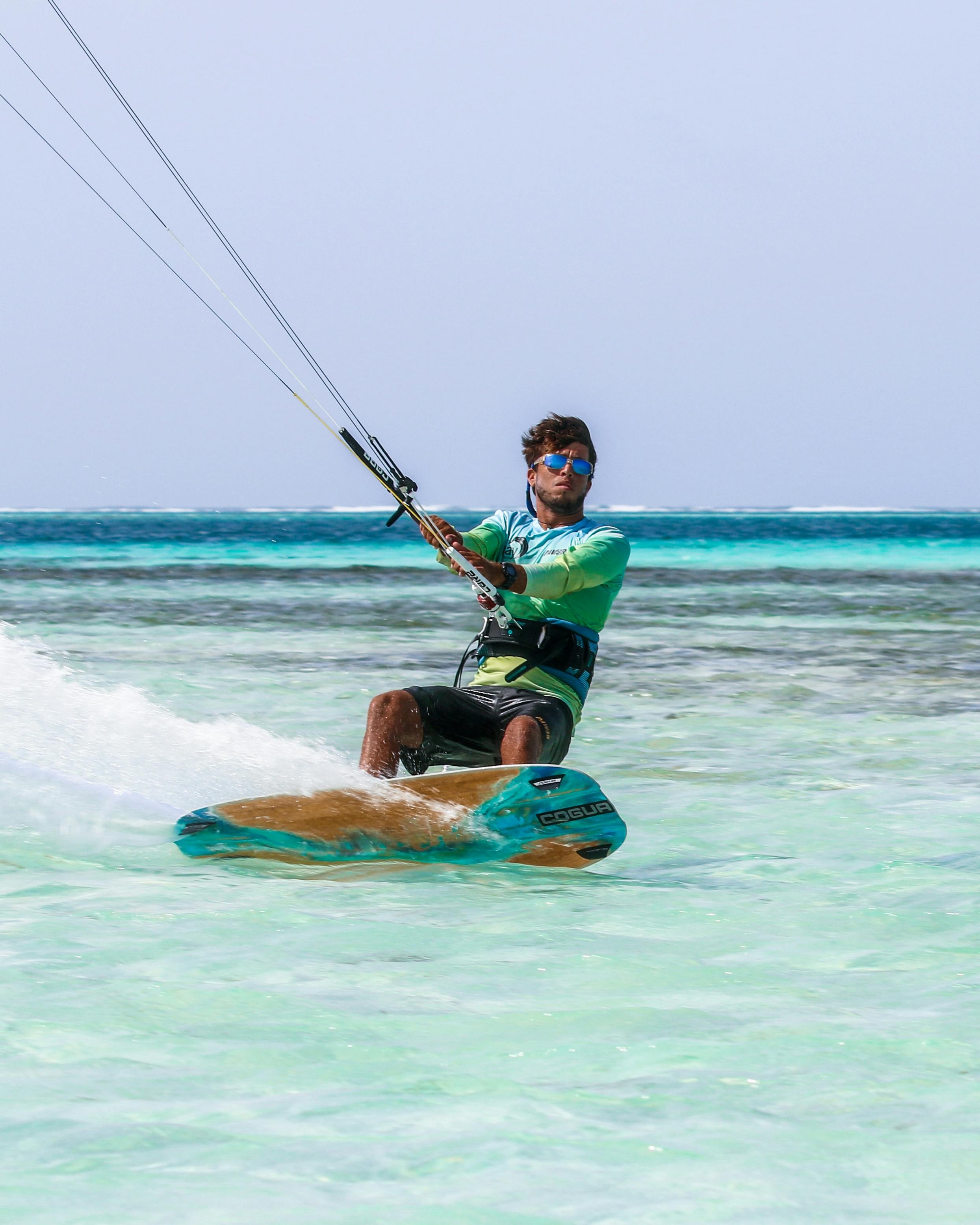 Man Kiteboarding on Tropical Ocean