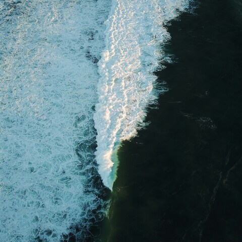 Aerial View of Breaking Ocean Wave