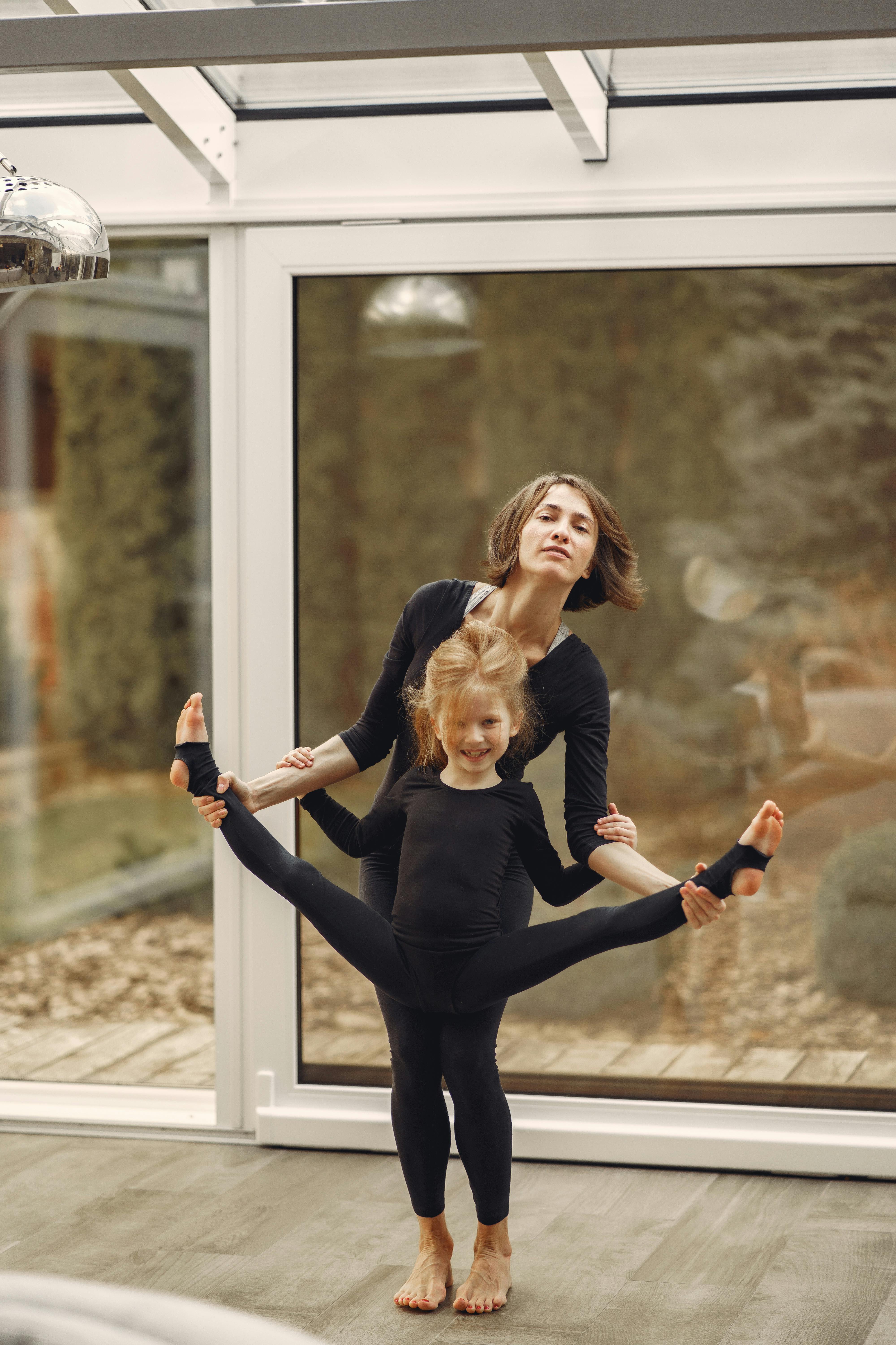 Mother and Daughter Practicing Yoga