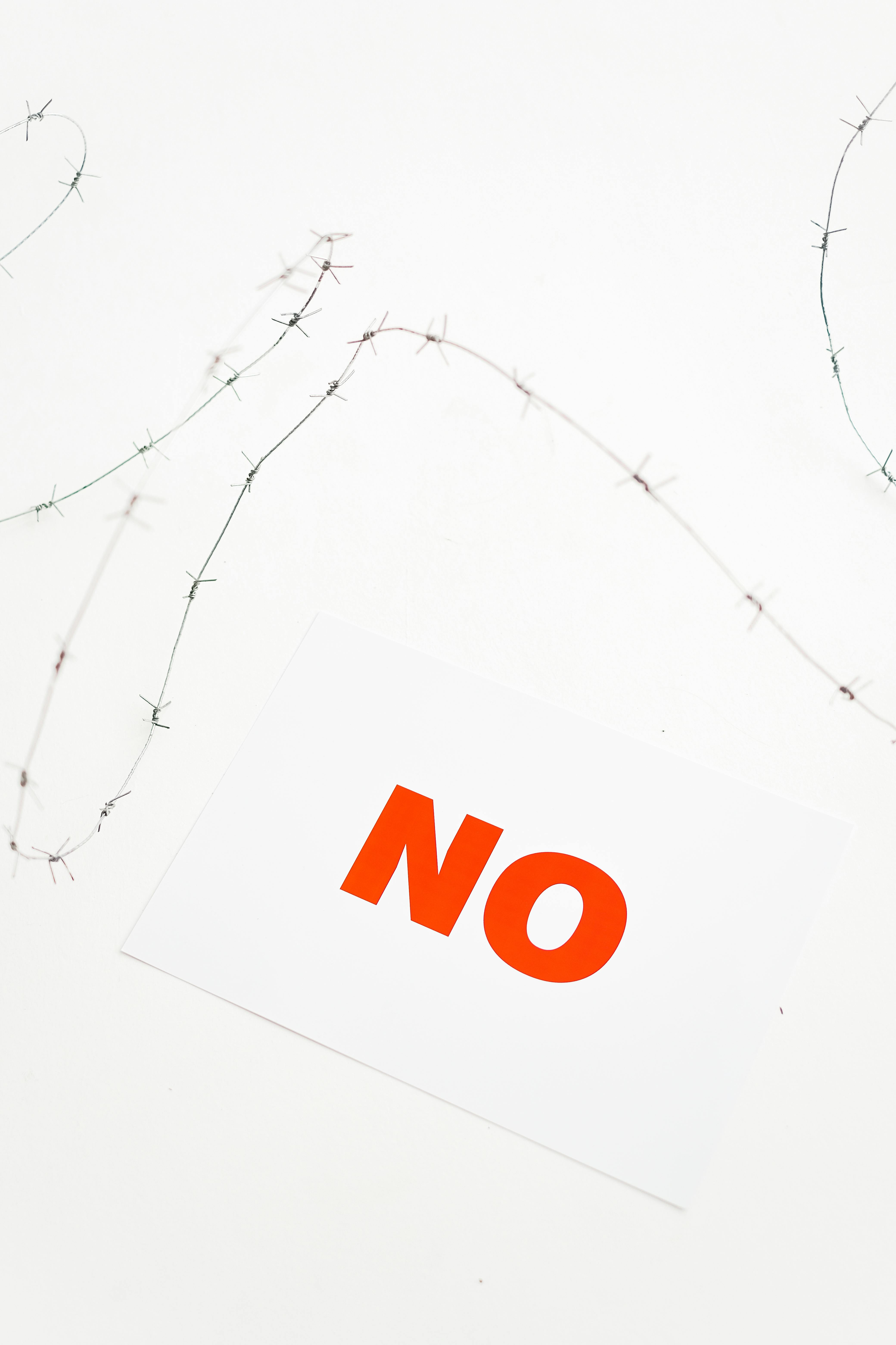 Bold NO Text With Barbed Wire