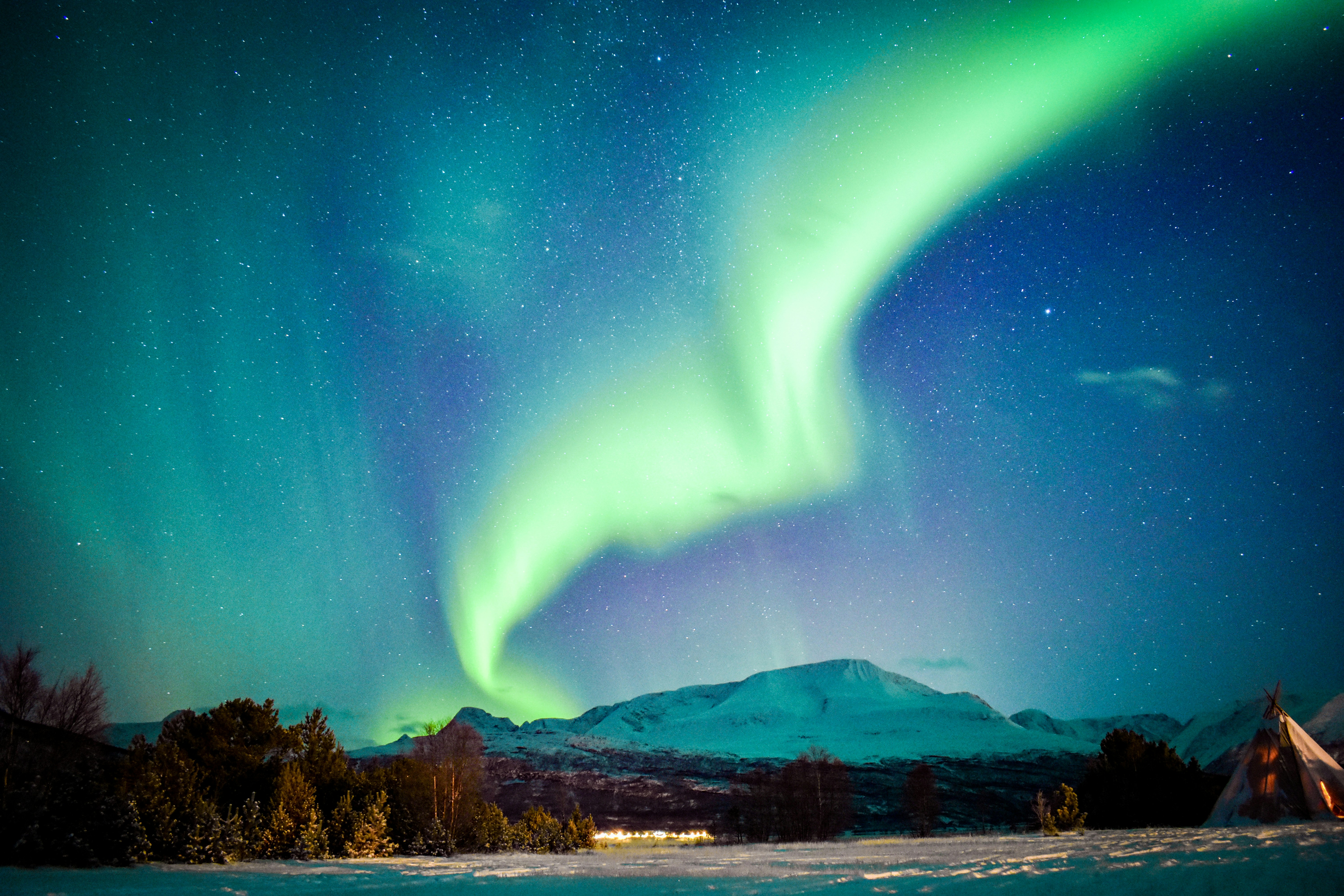 Aurora Borealis Over Snowy Mountains