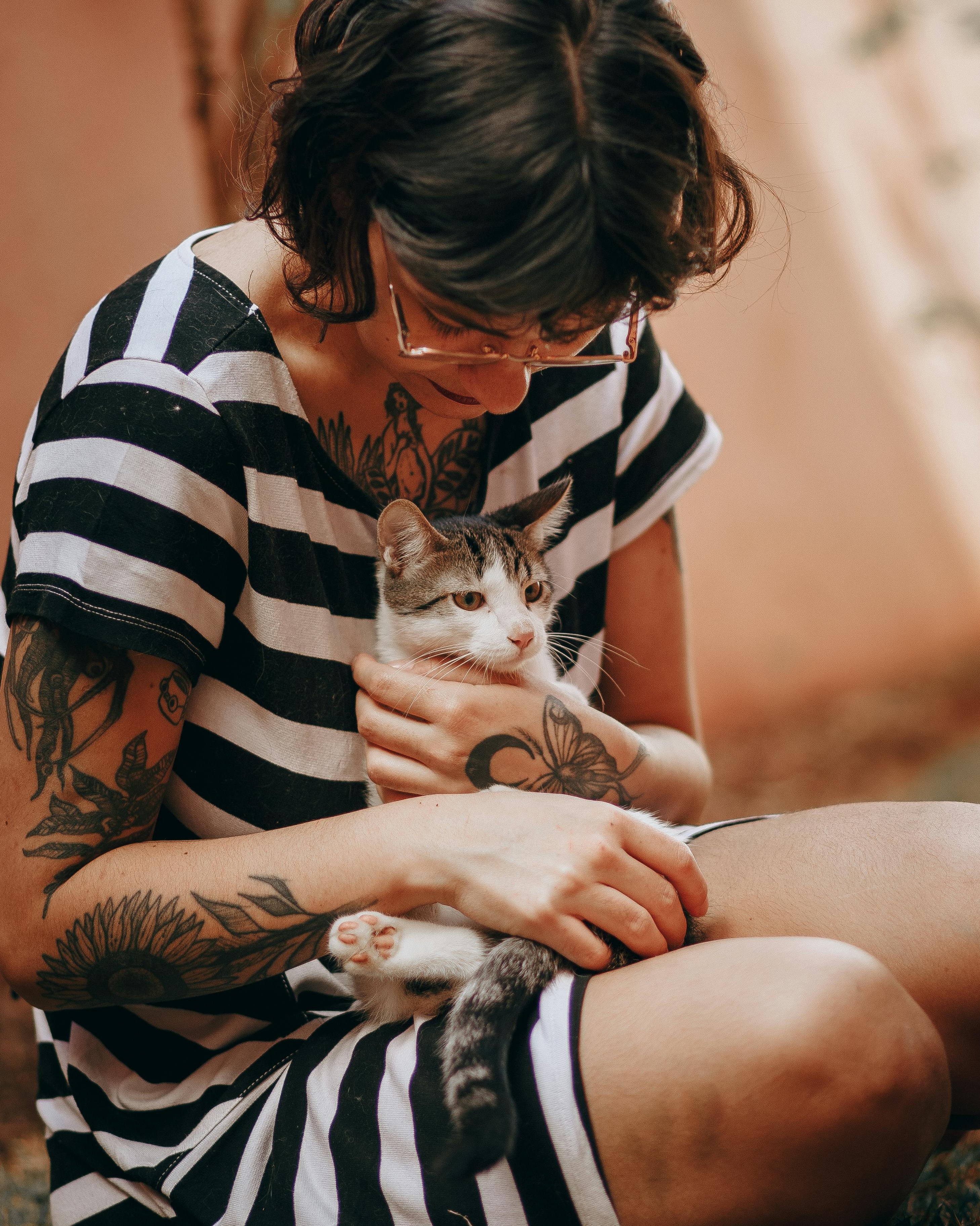 Tattooed Woman Holding a Cat