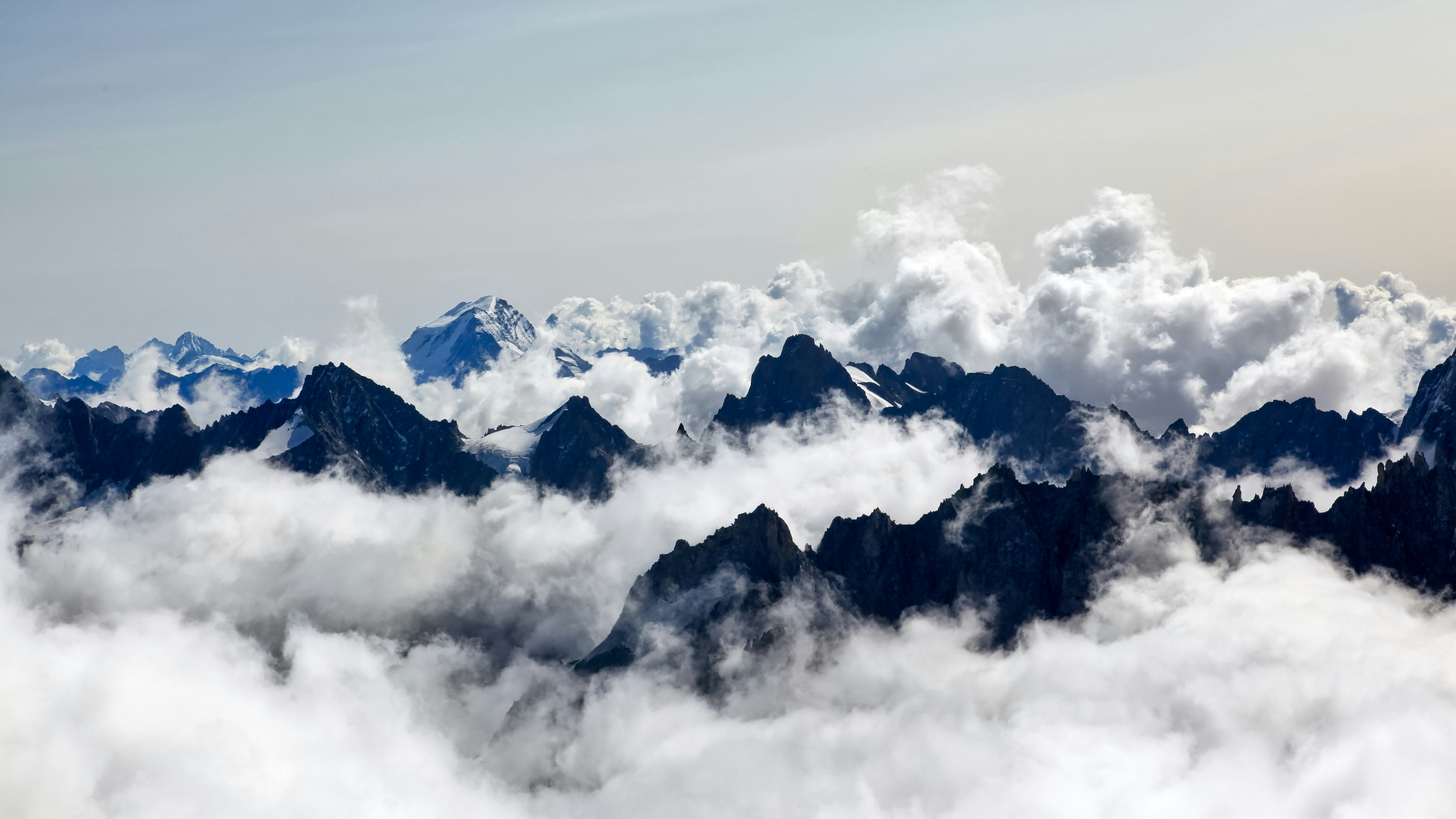 Snow-capped Peaks Above Cloud Sea