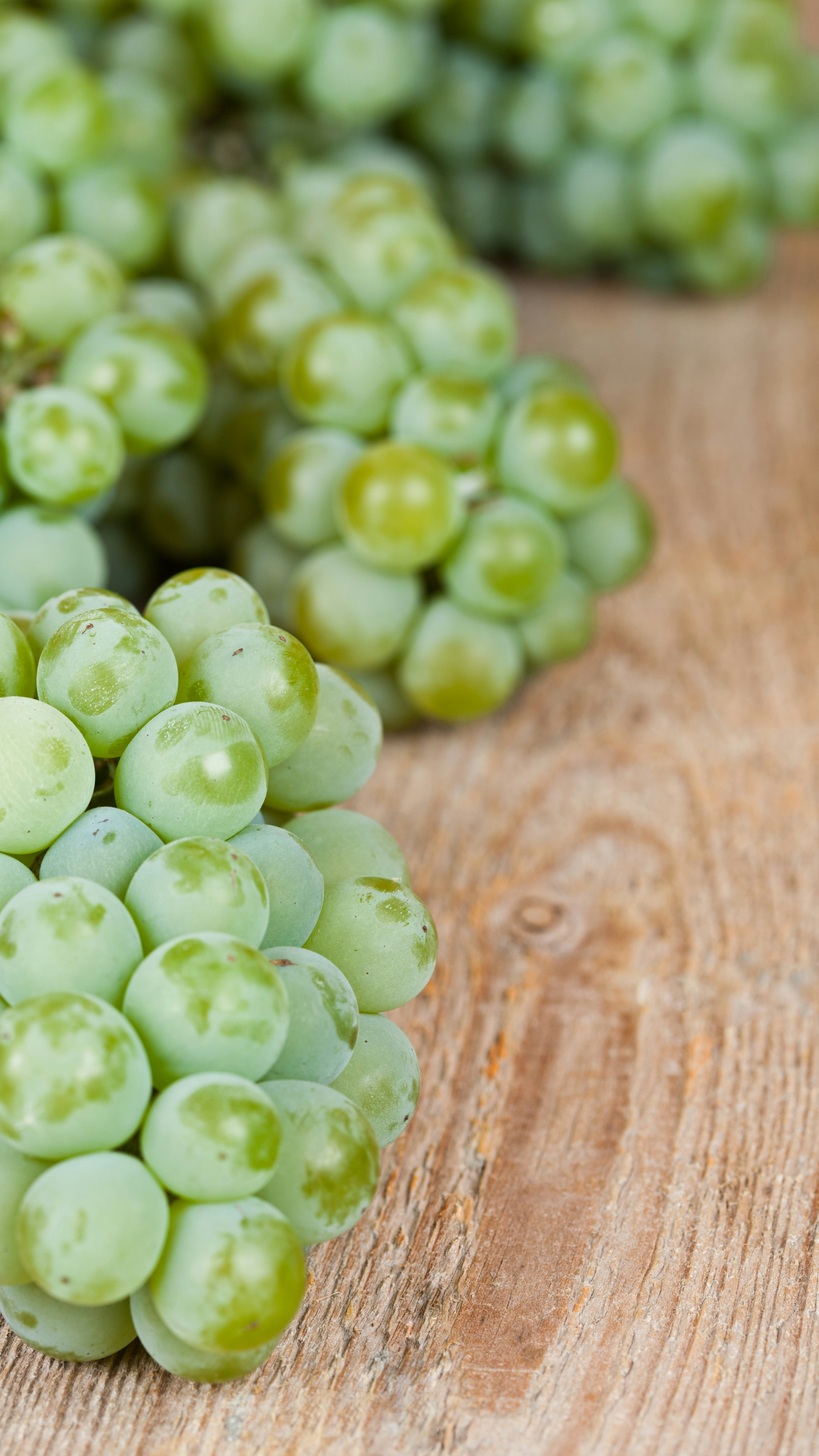 Green Grapes on Rustic Wood