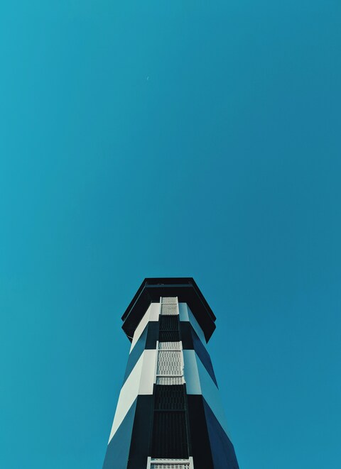 Low-angle View of Striped Lighthouse