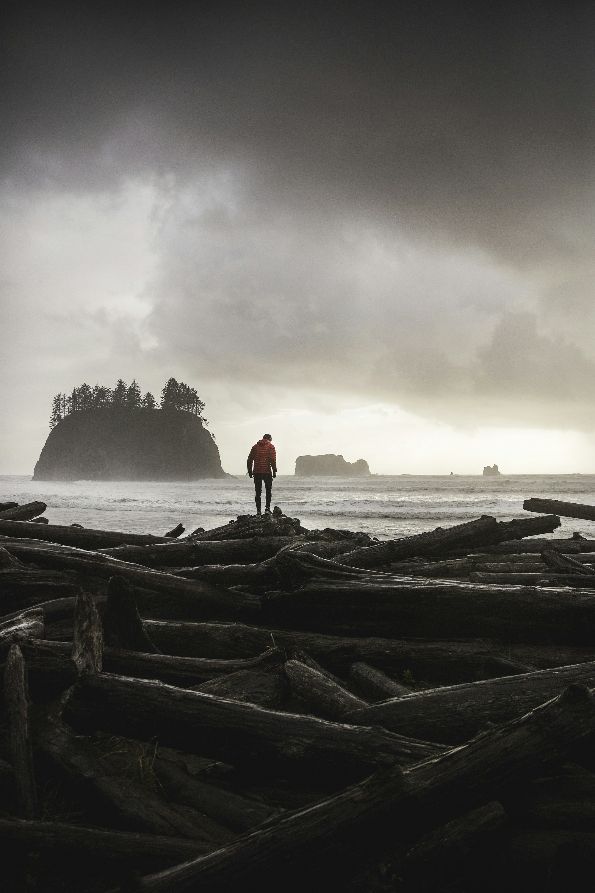 Lone Figure on Stormy Coastal Beach