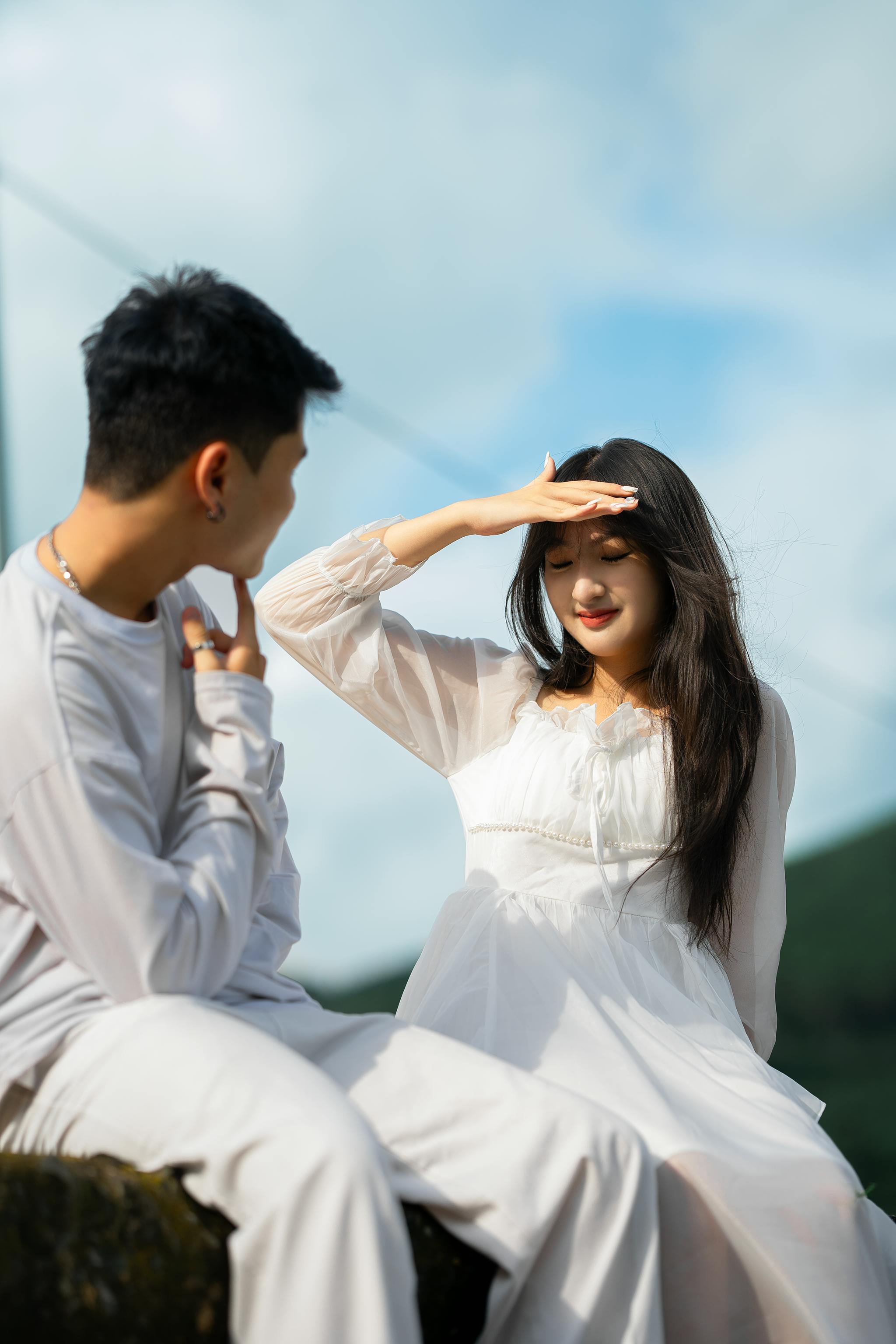 Young Couple Sitting Outdoors
