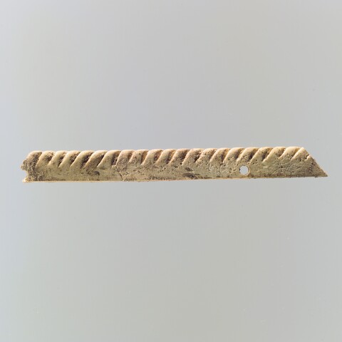 Carved Twisted Pattern Bone Artifact