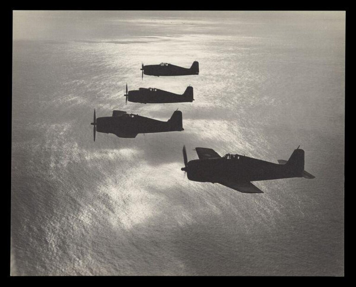 Four Fighter Planes Over Ocean