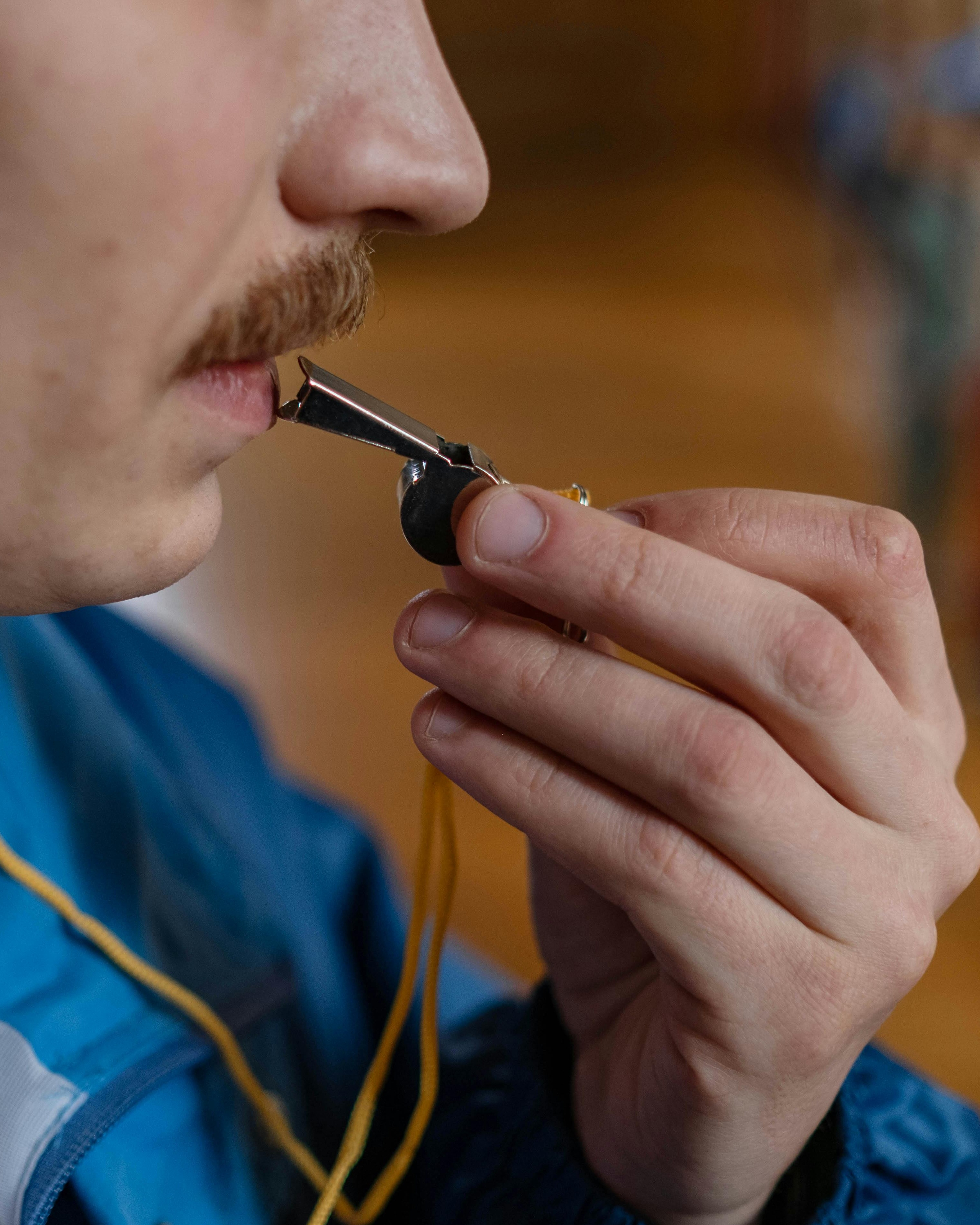 Referee Blowing a Whistle