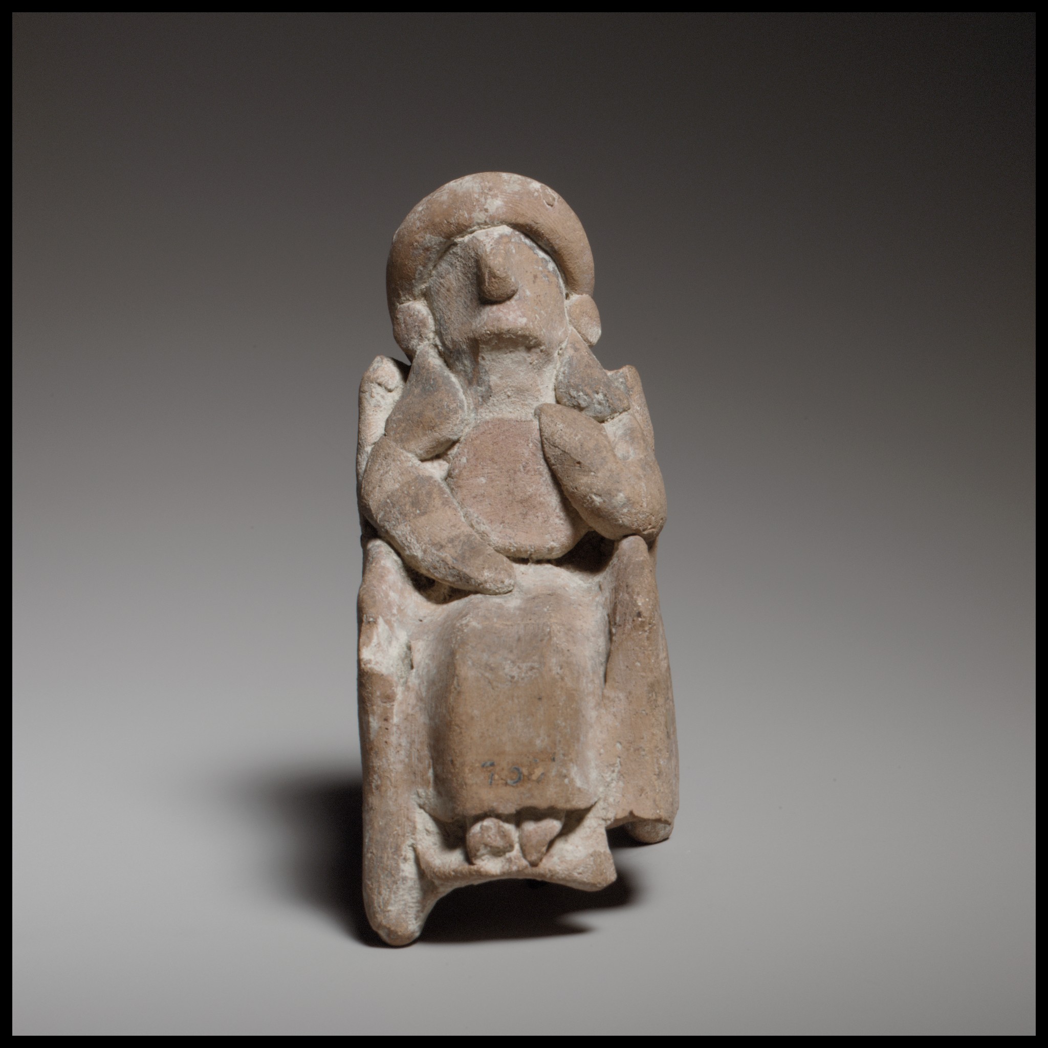 Ancient Seated Clay Figurine