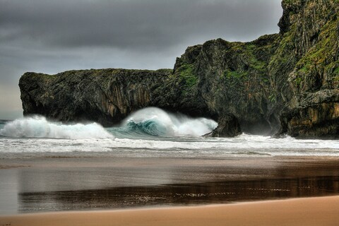 Waves Crashing Against Coastal Cliffs