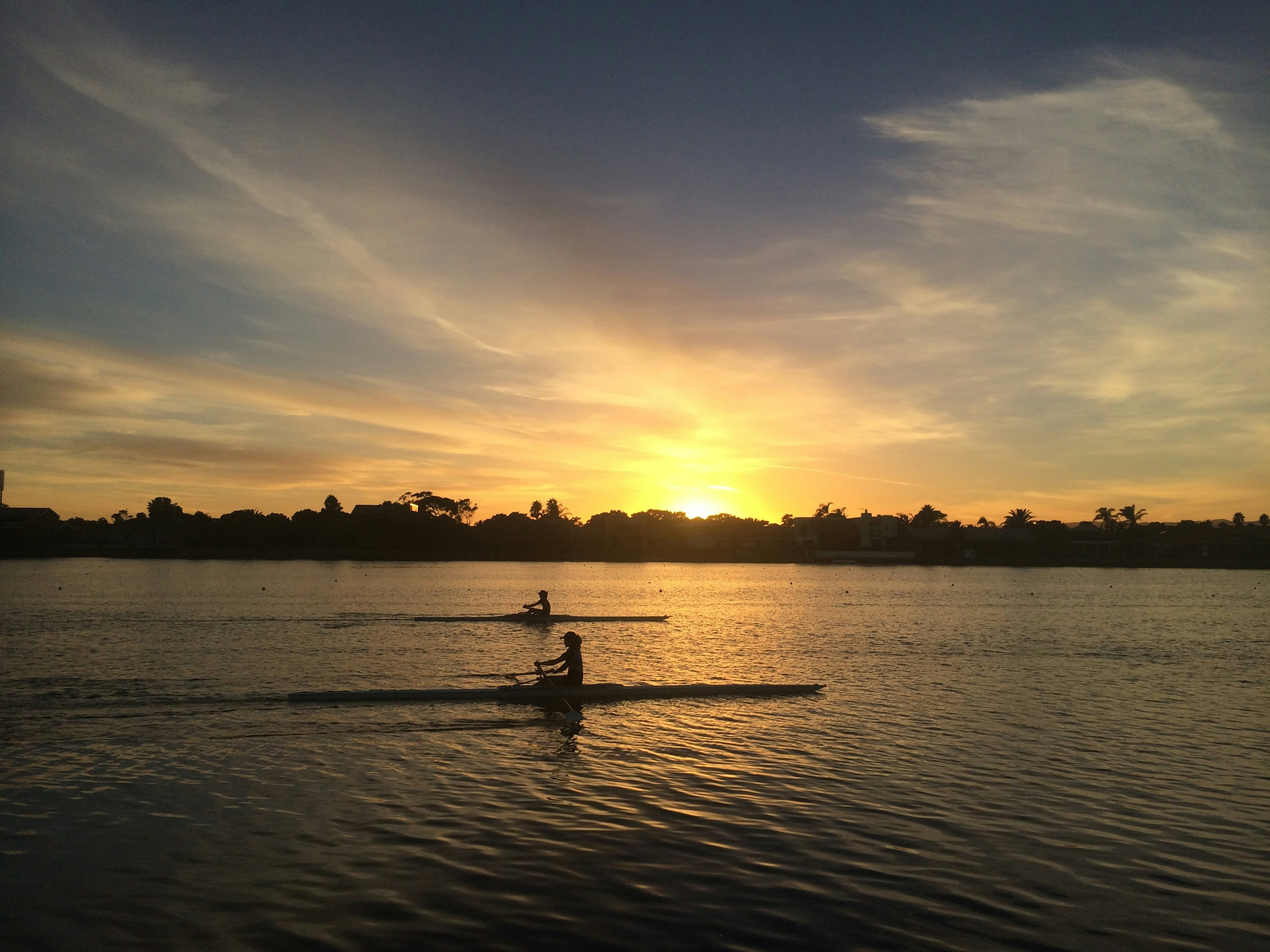 Sunset Rowing on Calm Lake