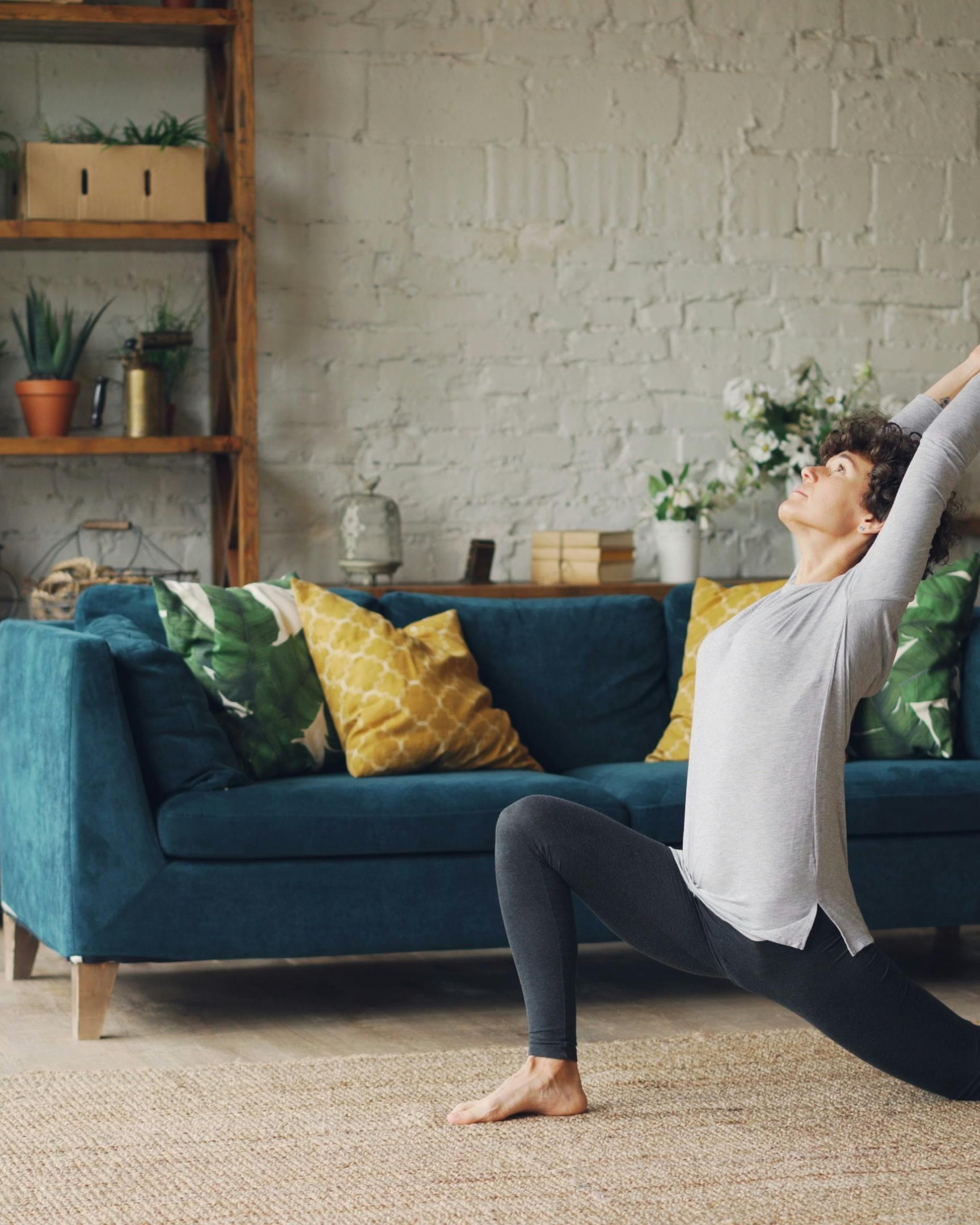 Woman Practicing Yoga at Home
