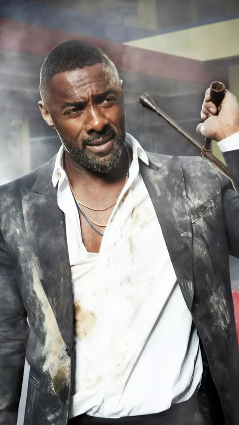 Idris Elba With Dirty Suit and Crowbar