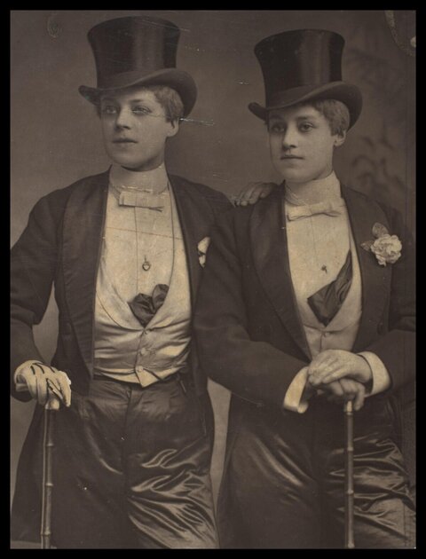 Vintage Portrait of Two People in Tuxedos