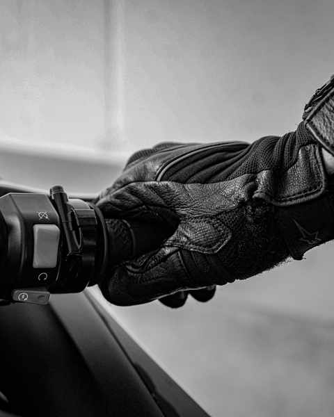 Gloved Hand on Motorcycle Throttle