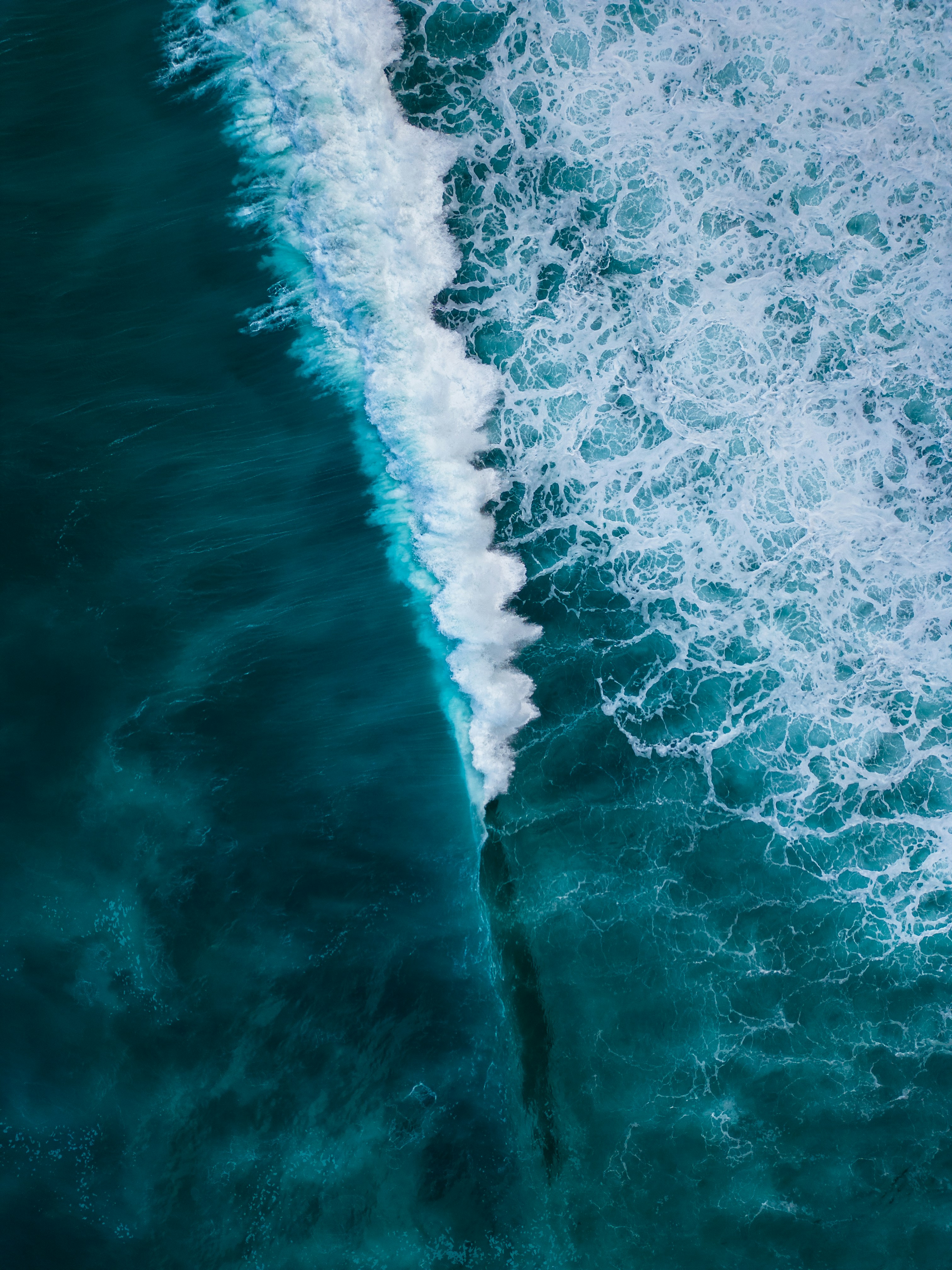 Aerial View of Breaking Ocean Wave