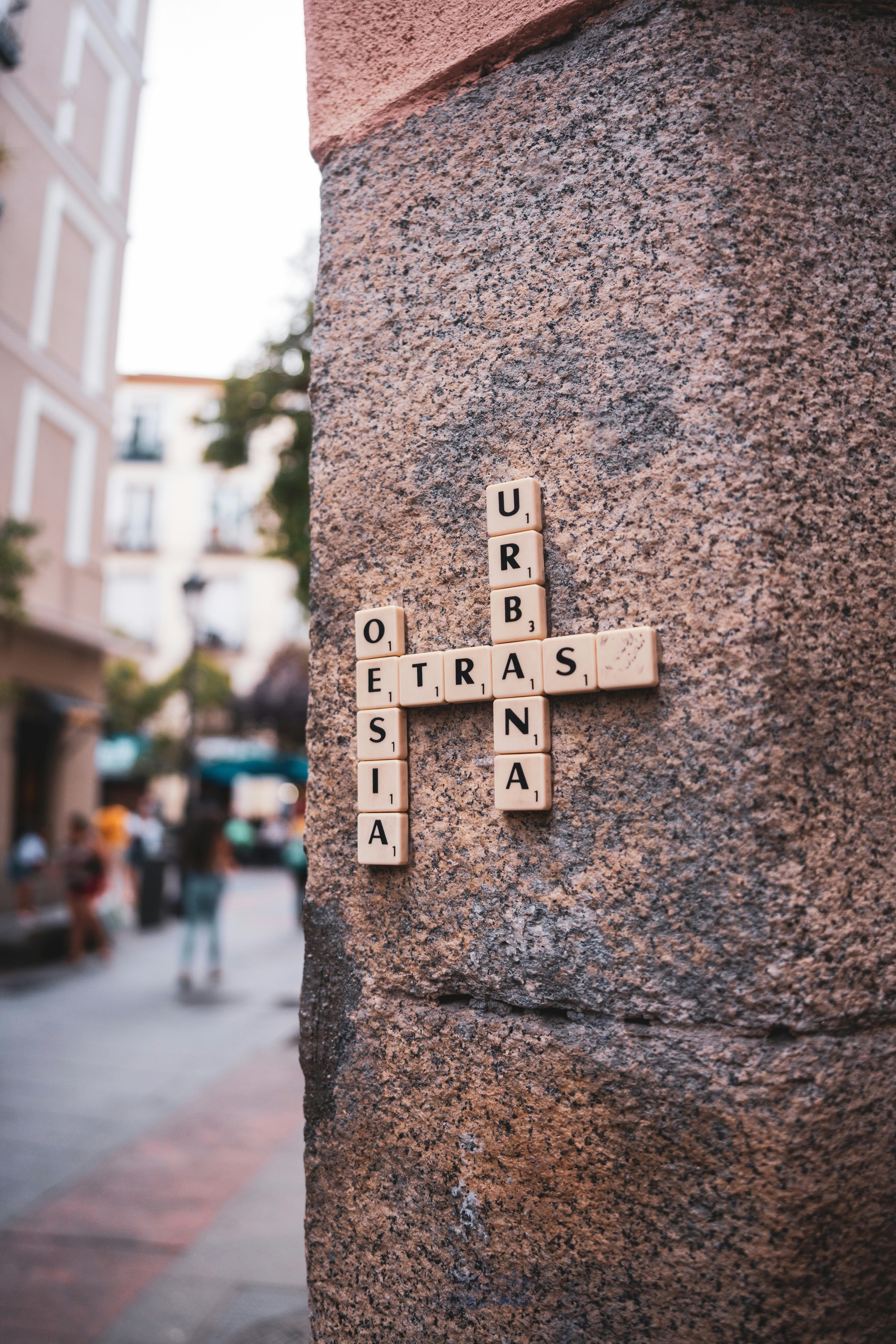 Scrabble Tile Crossword on Stone Pillar