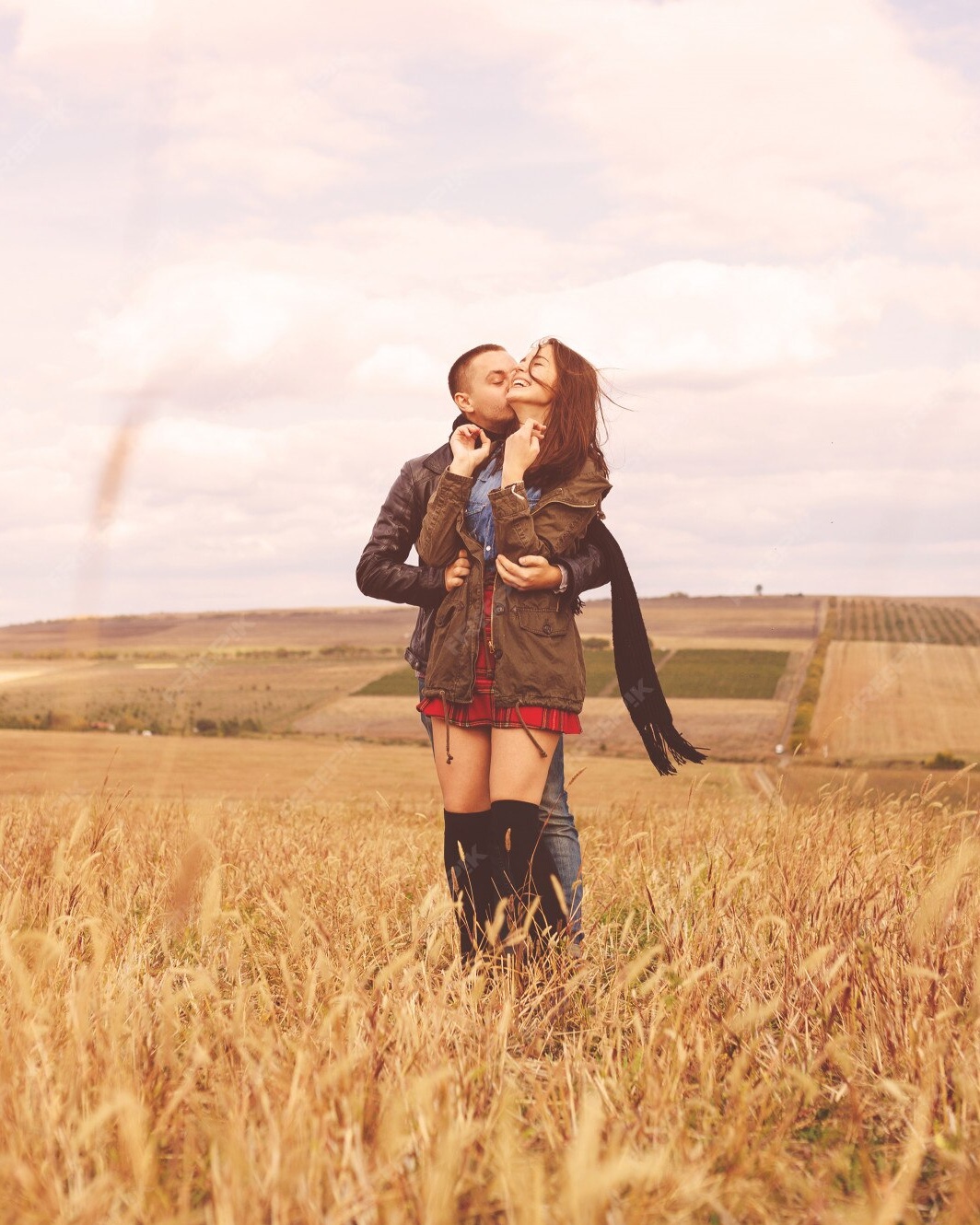 Couple Kissing In Golden Grass Field