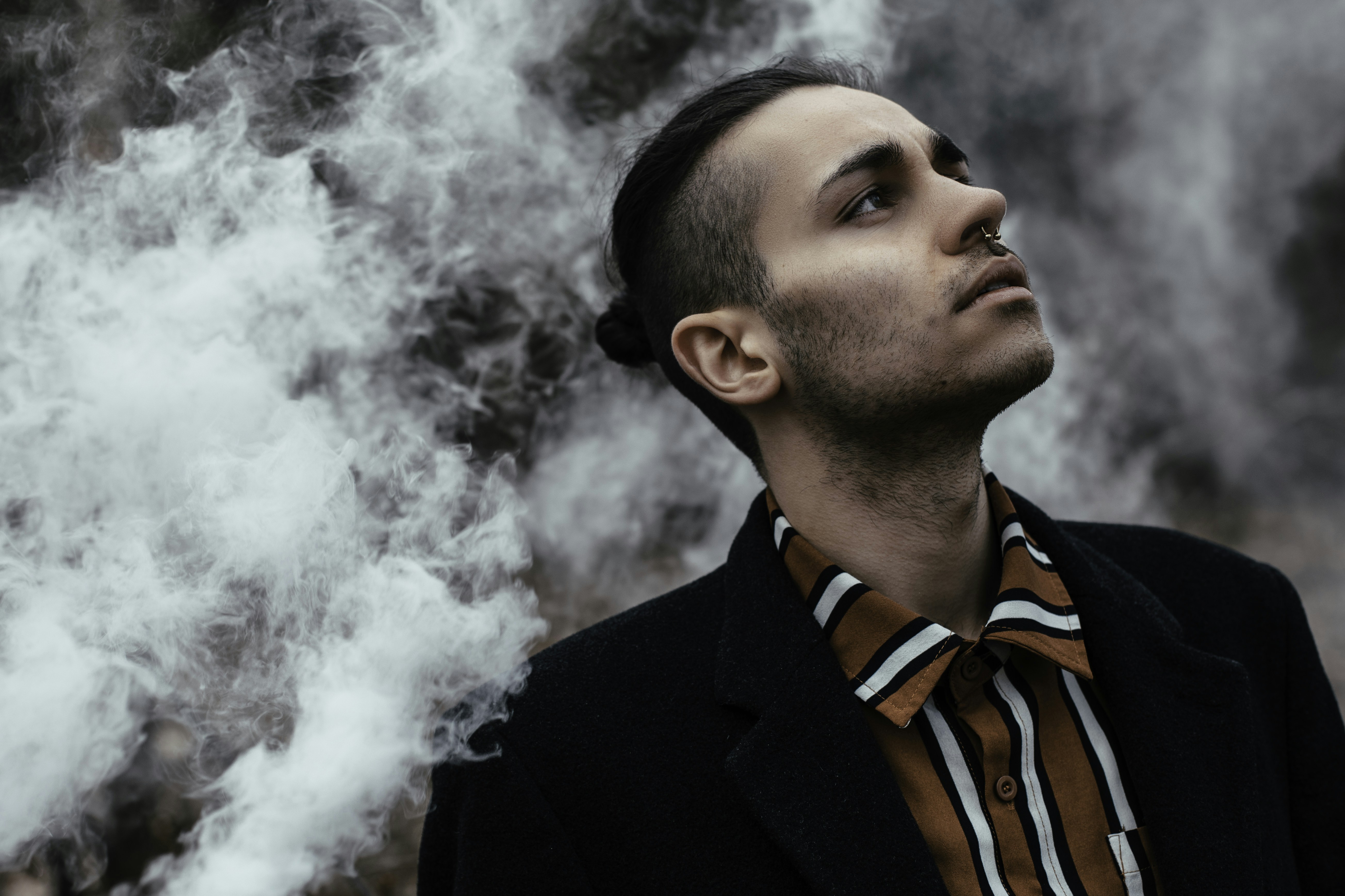 Stylish Man Exhaling Smoke