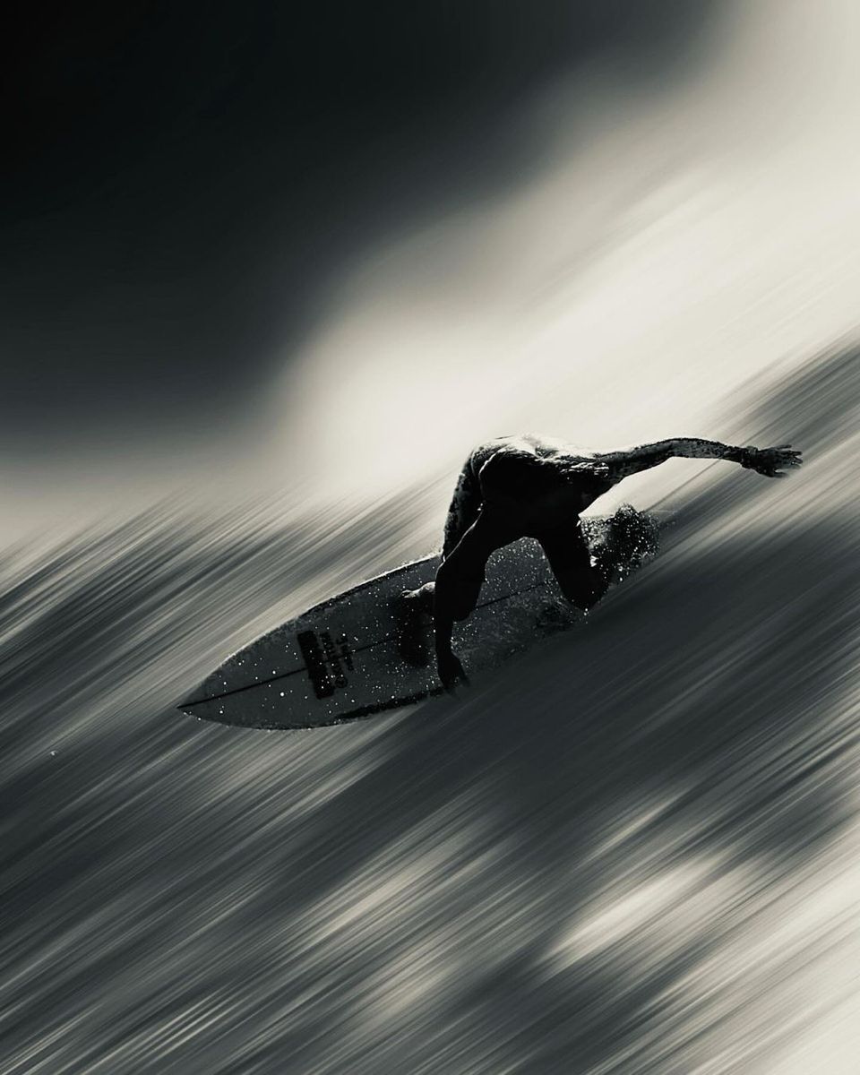 Silhouette Surfer Riding Fast Wave