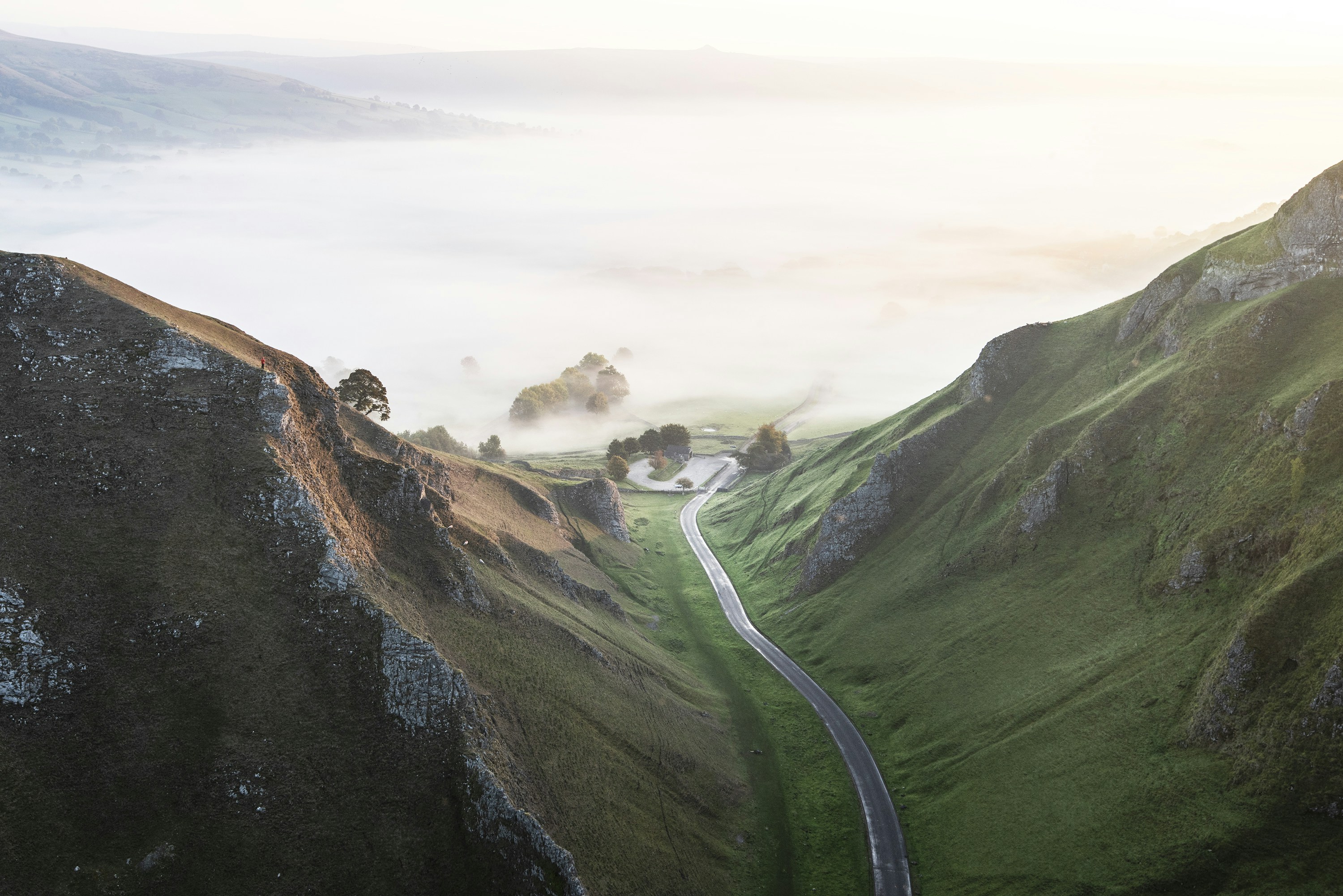 Winding Road in Misty Valley