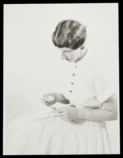 Black and White Portrait of Woman With Daisy