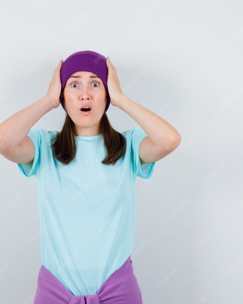 Shocked Woman With Hands on Head