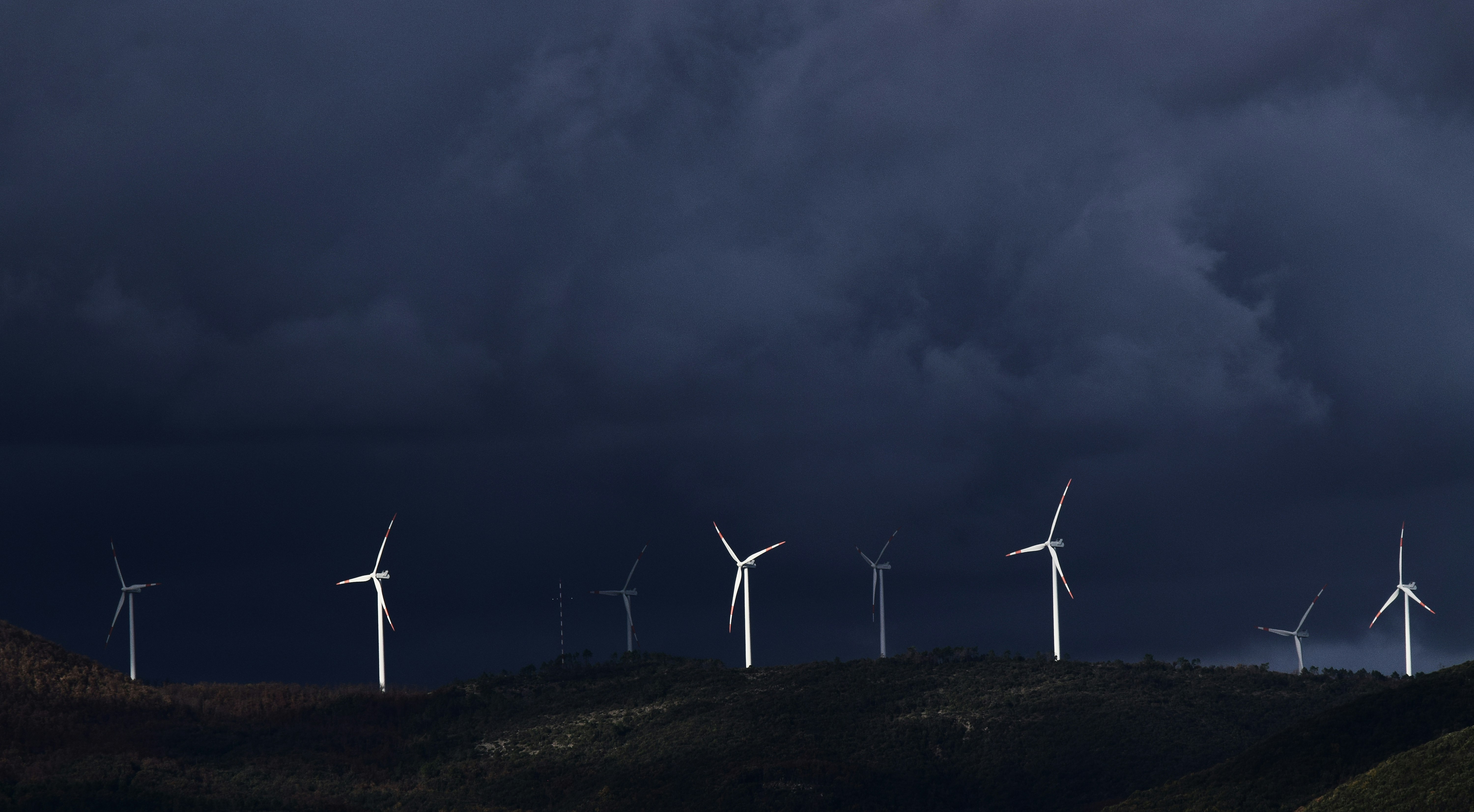 Wind Turbines Under Storm Clouds