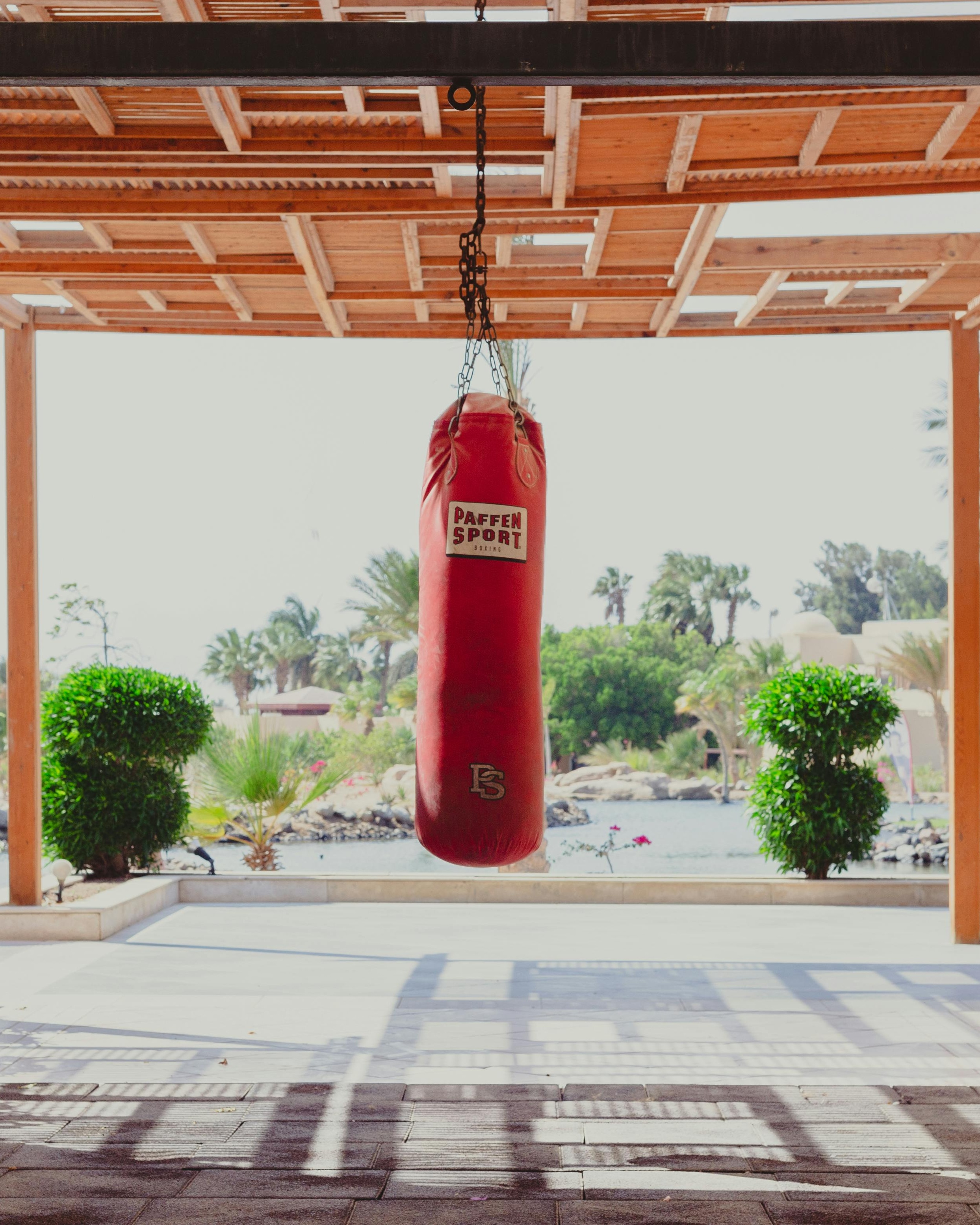Red Punching Bag Hanging Outdoors