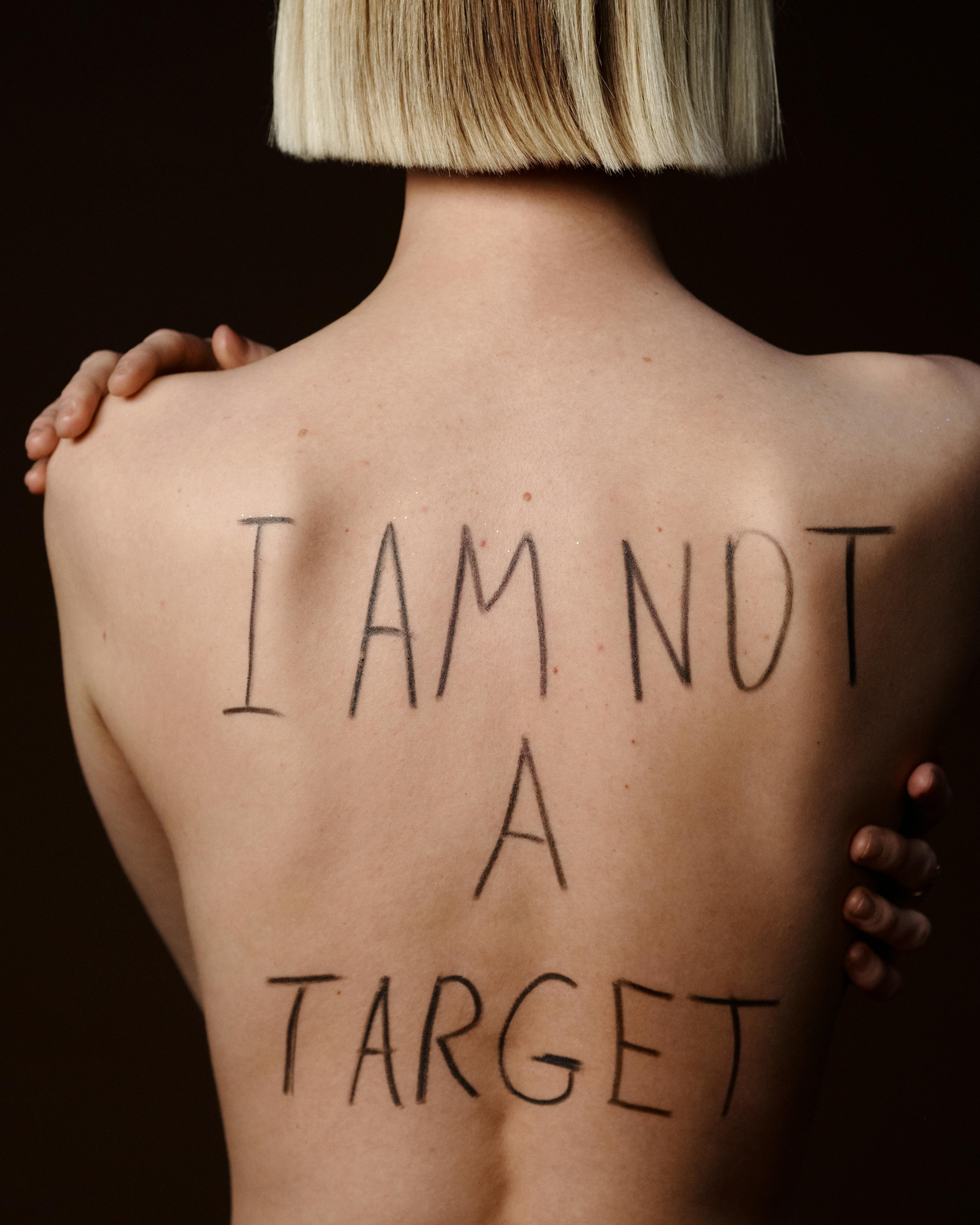 I Am Not A Target Message On Woman's Back