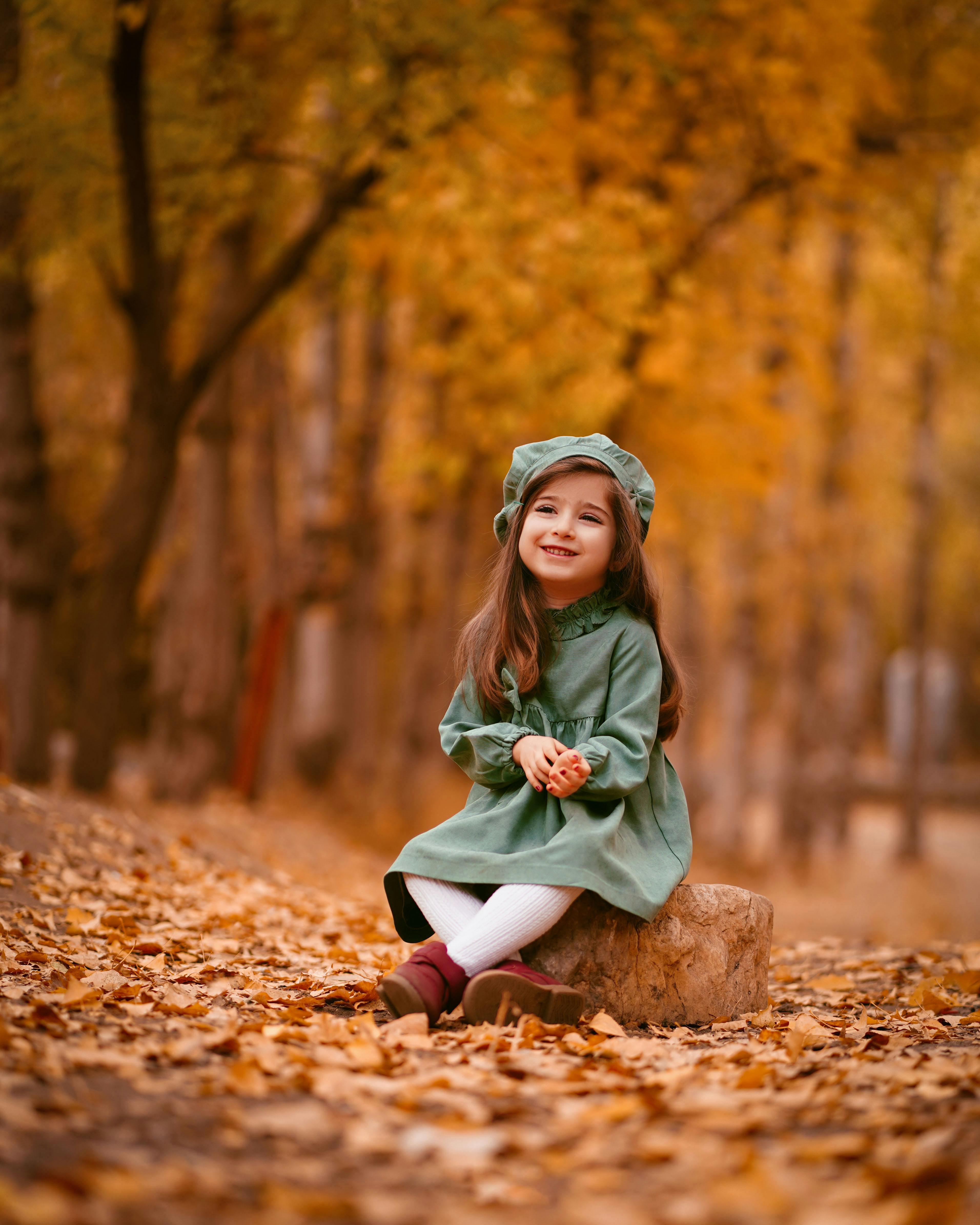 Little Girl In Autumn Forest
