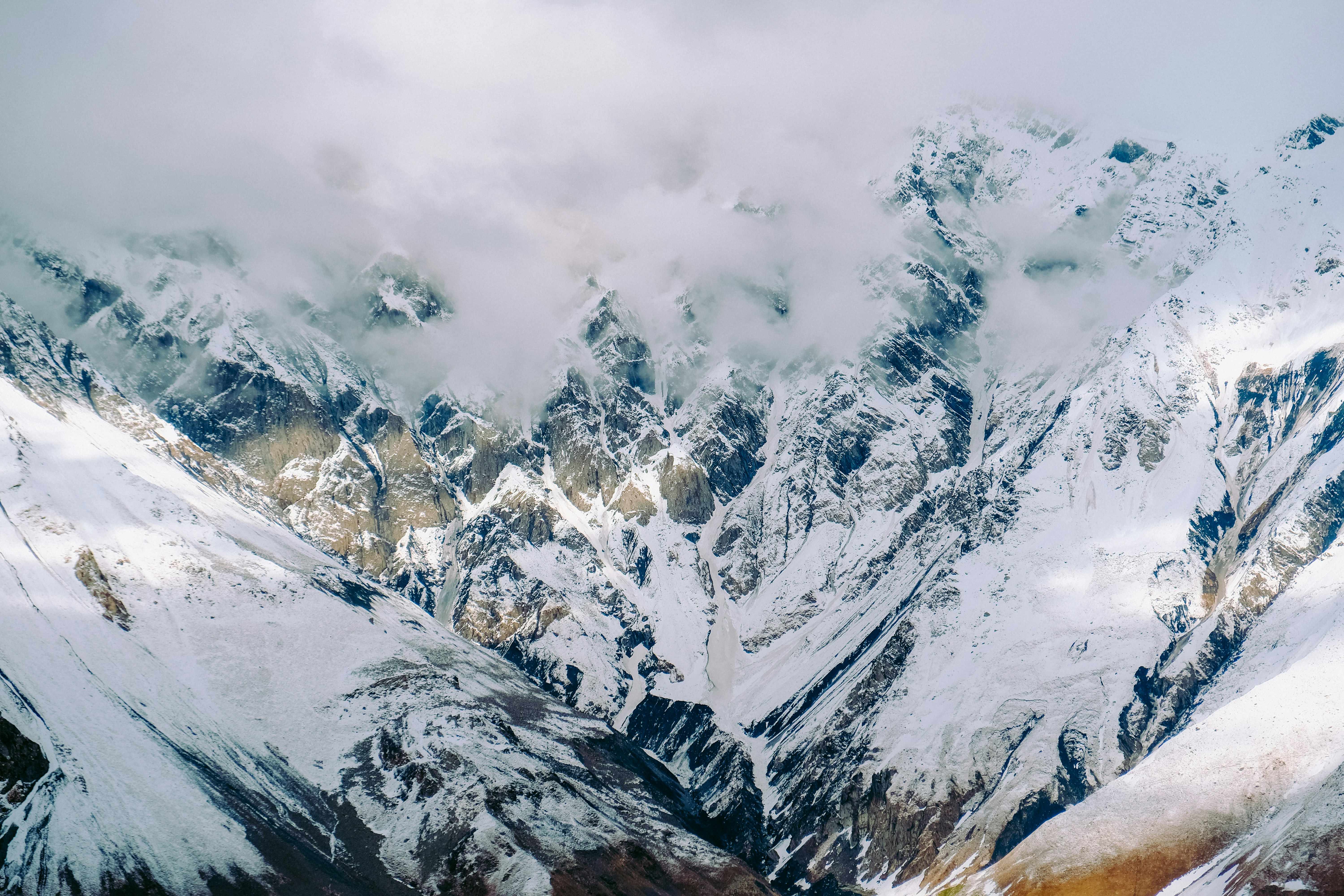 Cloud-shrouded Snowy Mountain Range