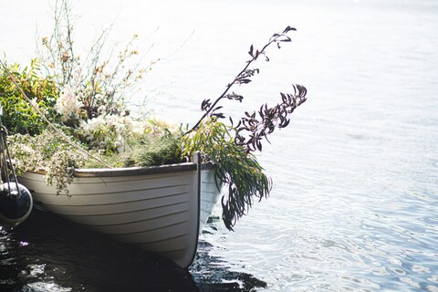 Flower Adorned Boat on Calm Water