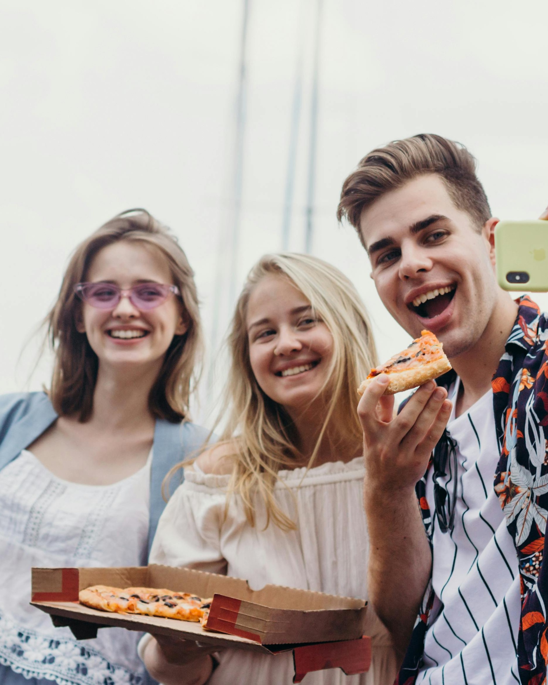 Friends Taking Selfie With Pizza