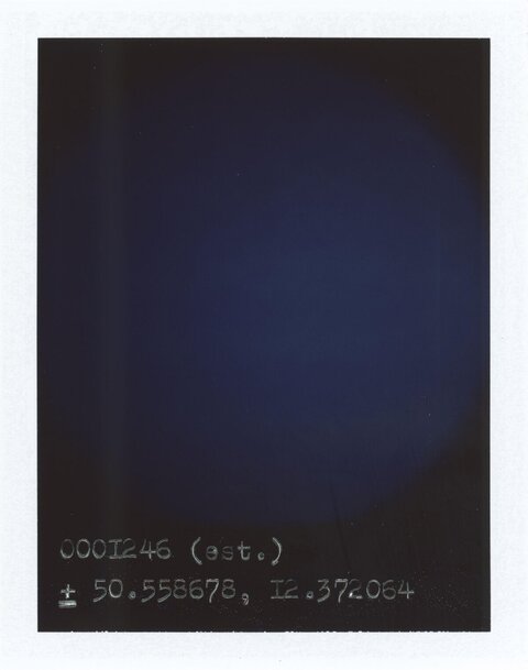Handwritten Coordinate Notation on Dark Background