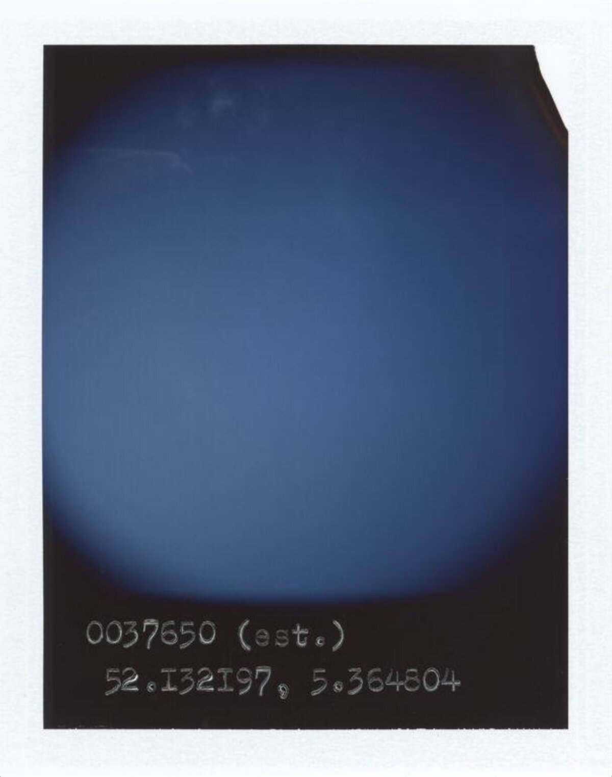 Polaroid With Handwritten Coordinates