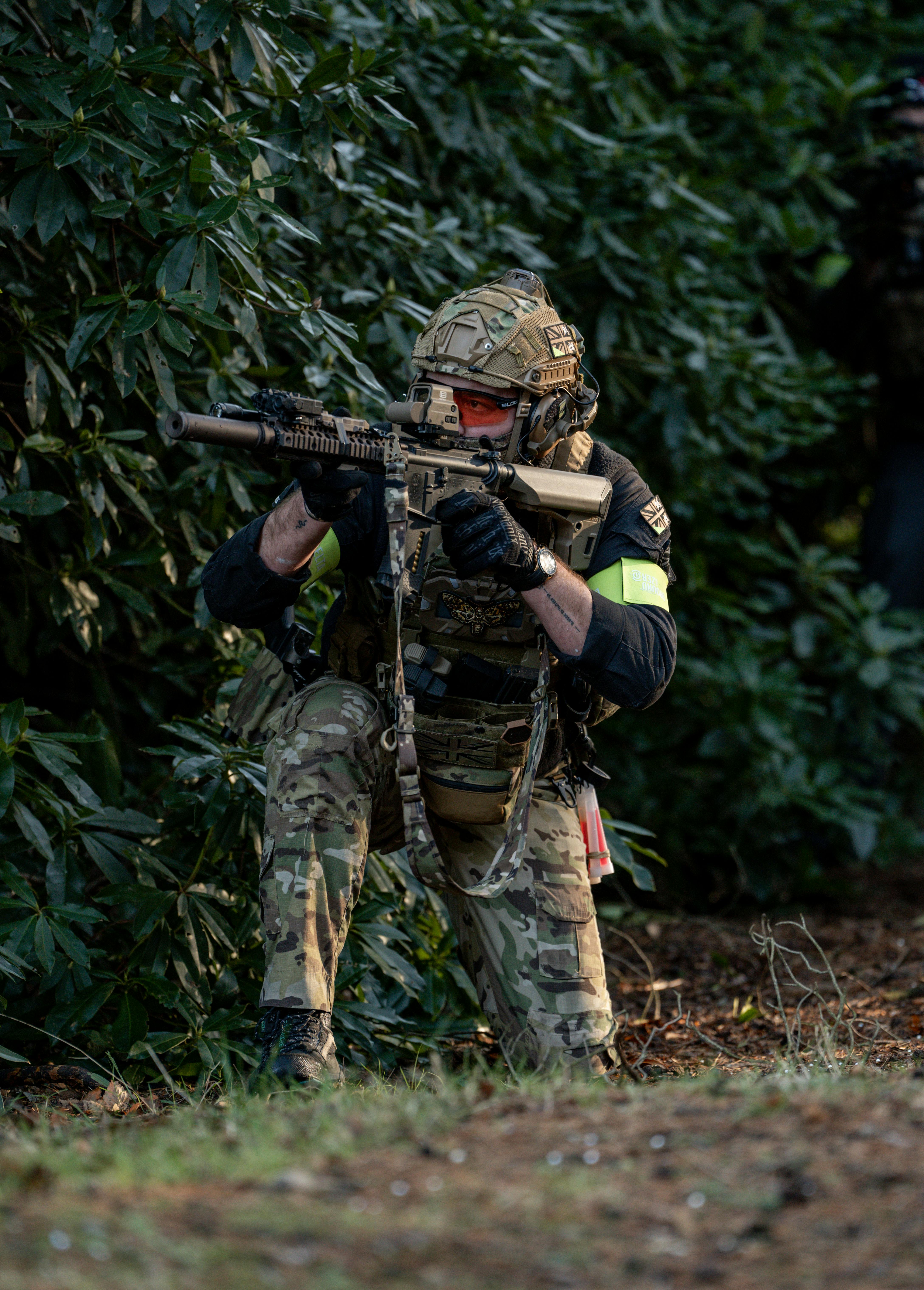 Tactical Airsoft Player Aiming Rifle