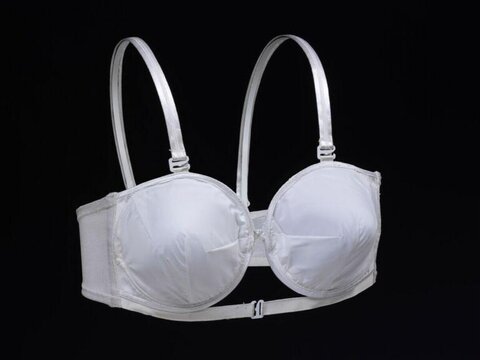 White Bra Against Black Background