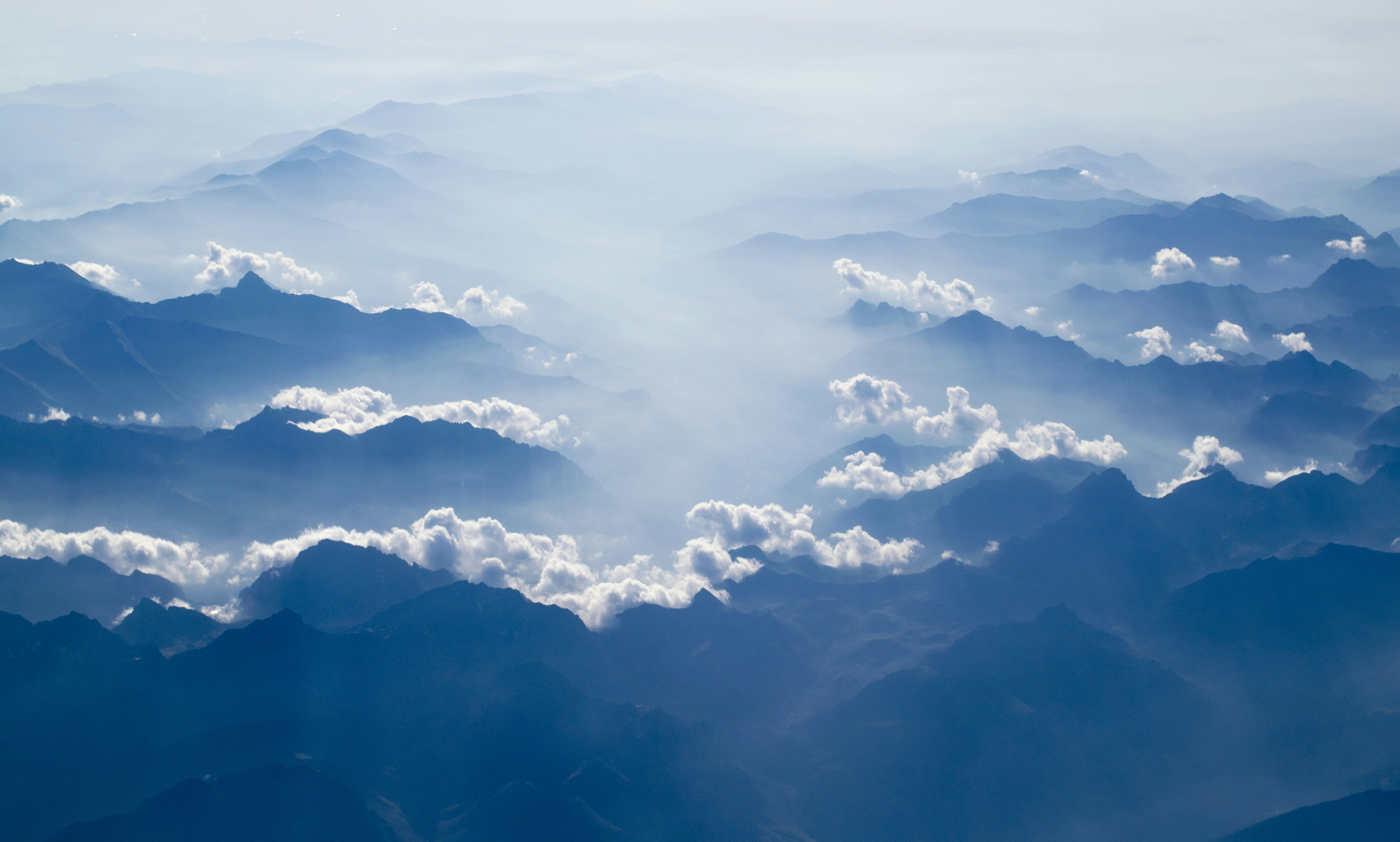 Layered Mountains Above Clouds