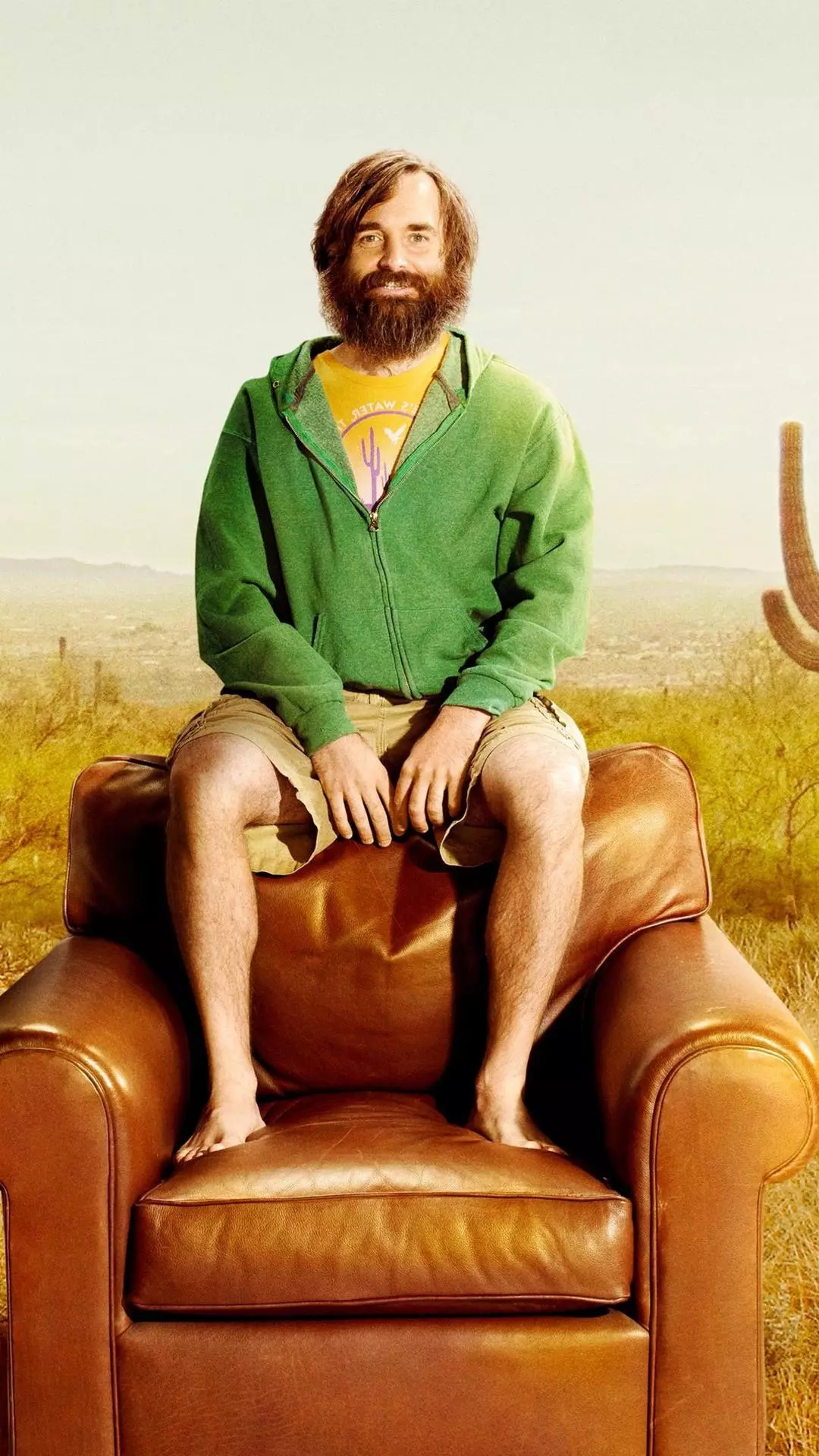 Bearded Man on Armchair in Desert