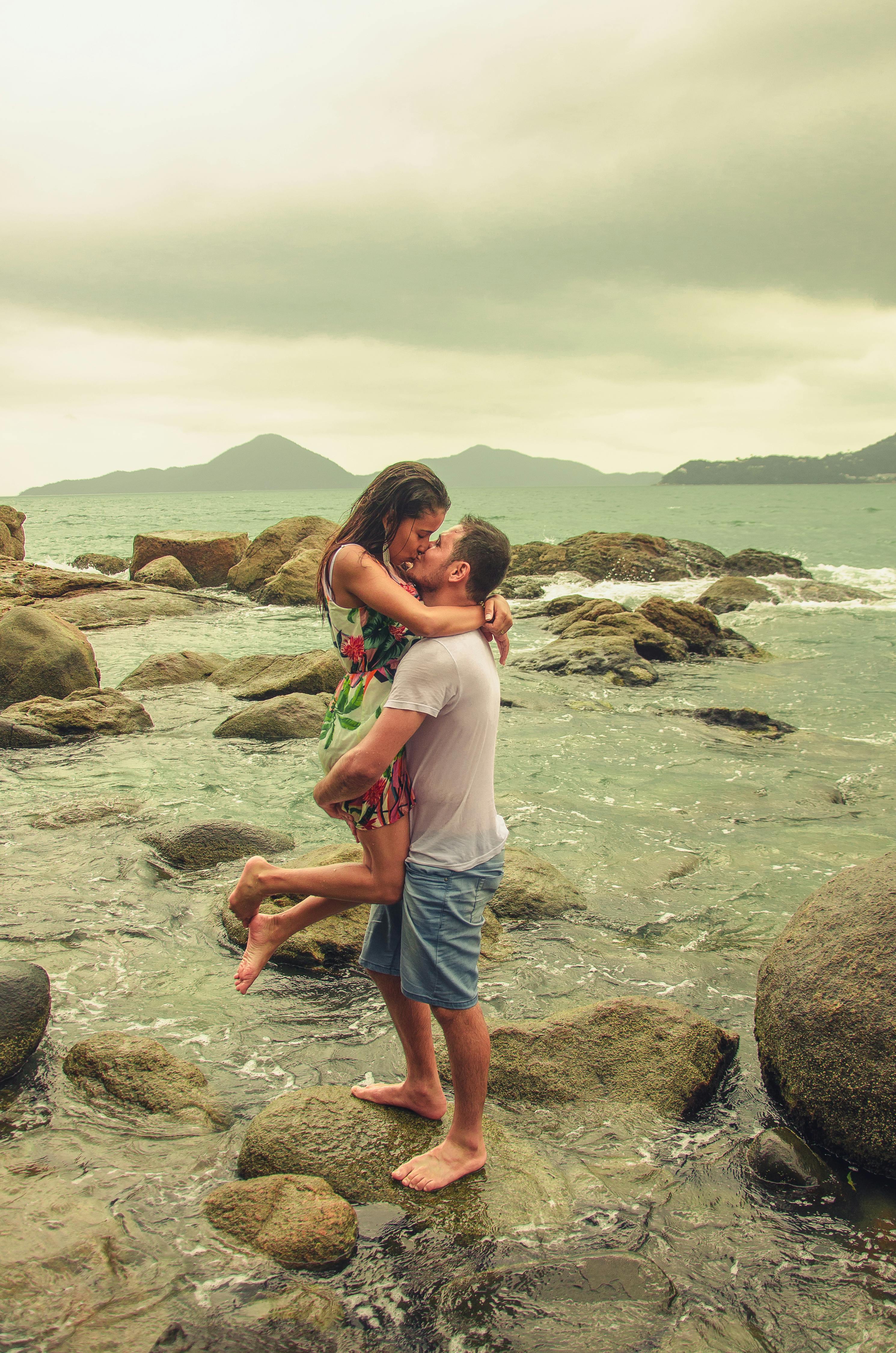 Couple Kissing on Rocky Seashore